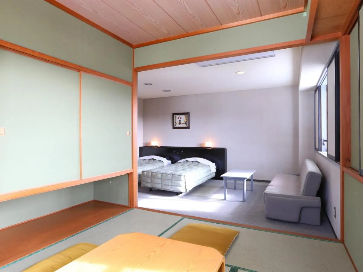 Photo of the whole room, Bed in Hotel Silk Inn Madarao