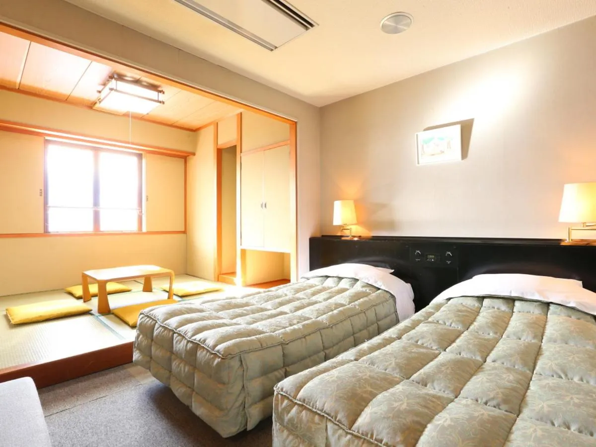 Photo of the whole room, Bed in Hotel Silk Inn Madarao