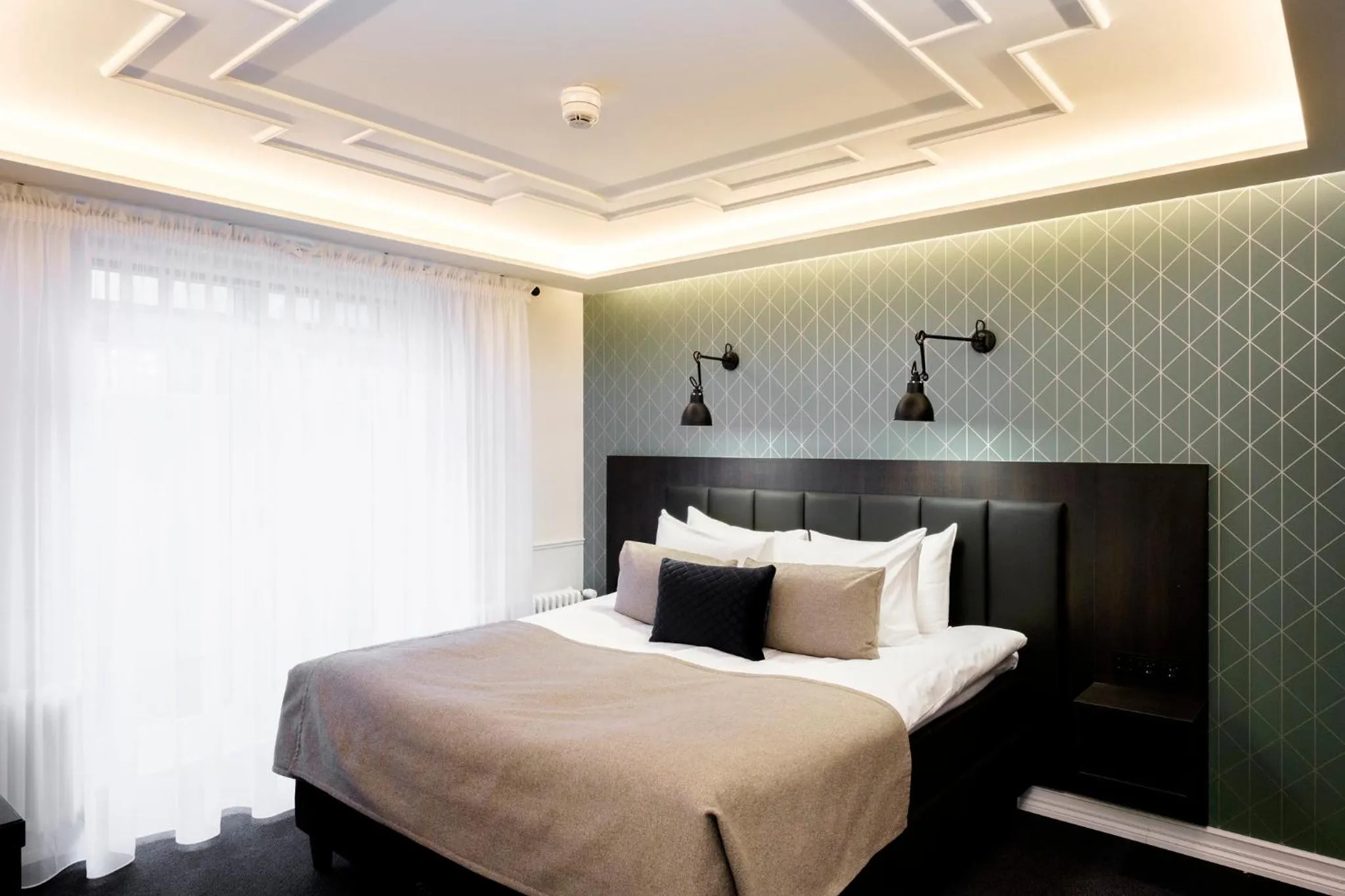 Bed in Hotel Reykjavík Saga