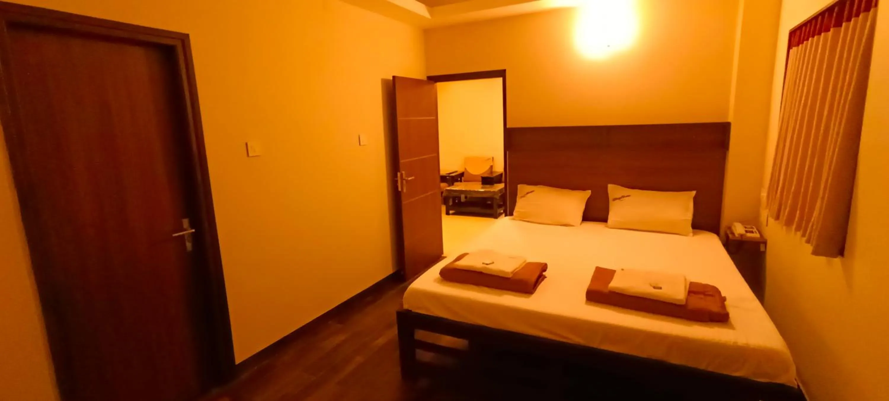 Bed in Hotel Rhythm Grand Suite