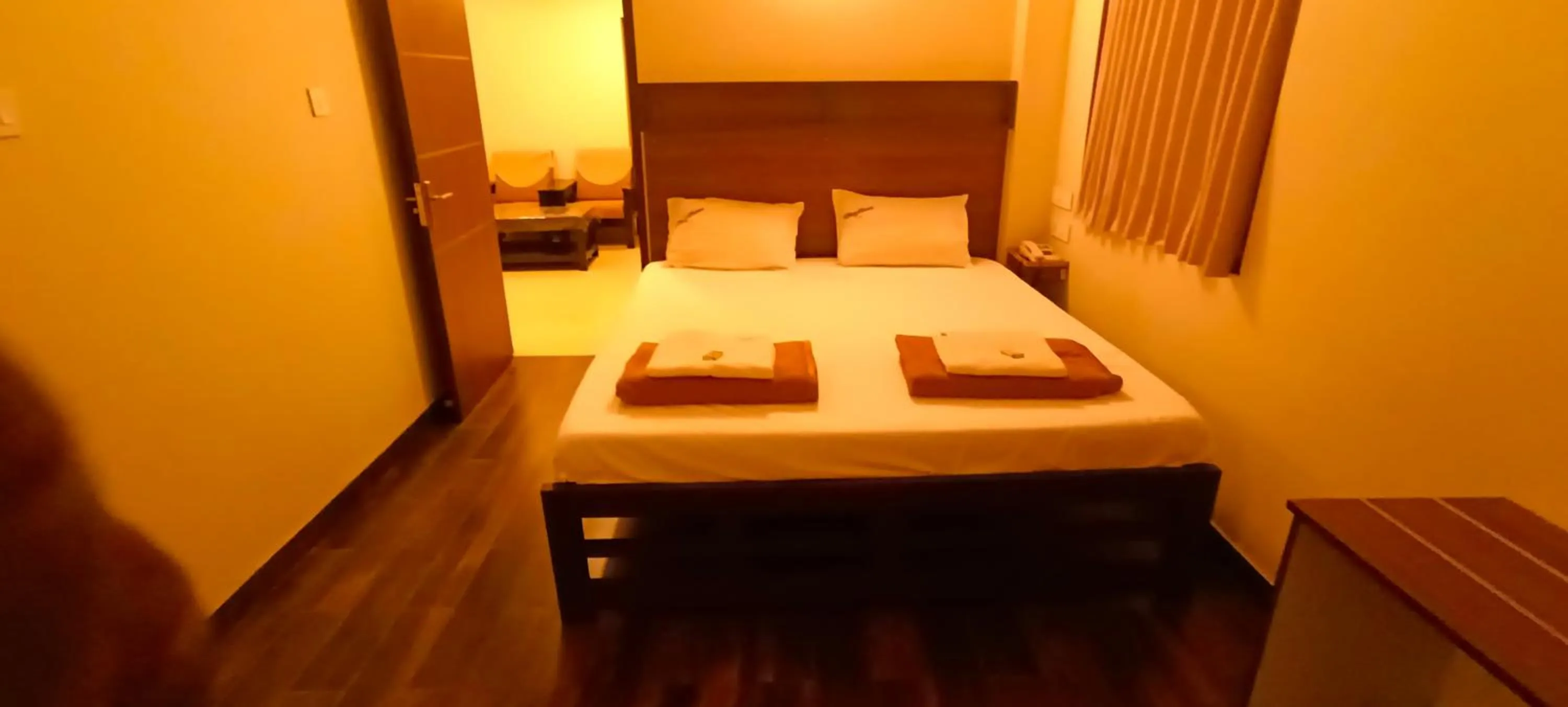 Bed in Hotel Rhythm Grand Suite