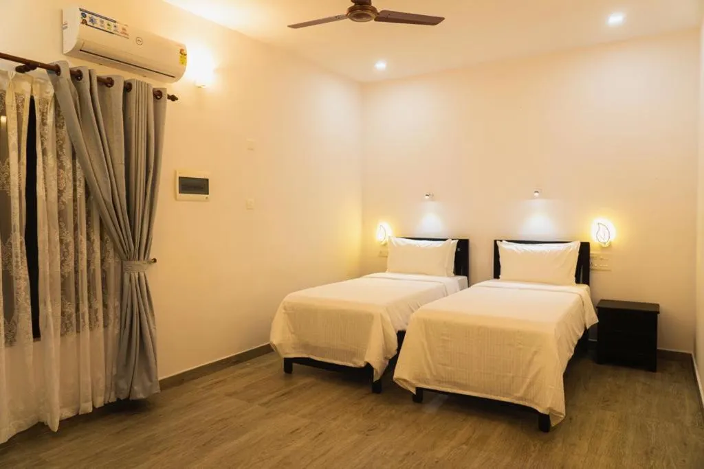 Bed in The Marine Pride Beach Resort & Spa