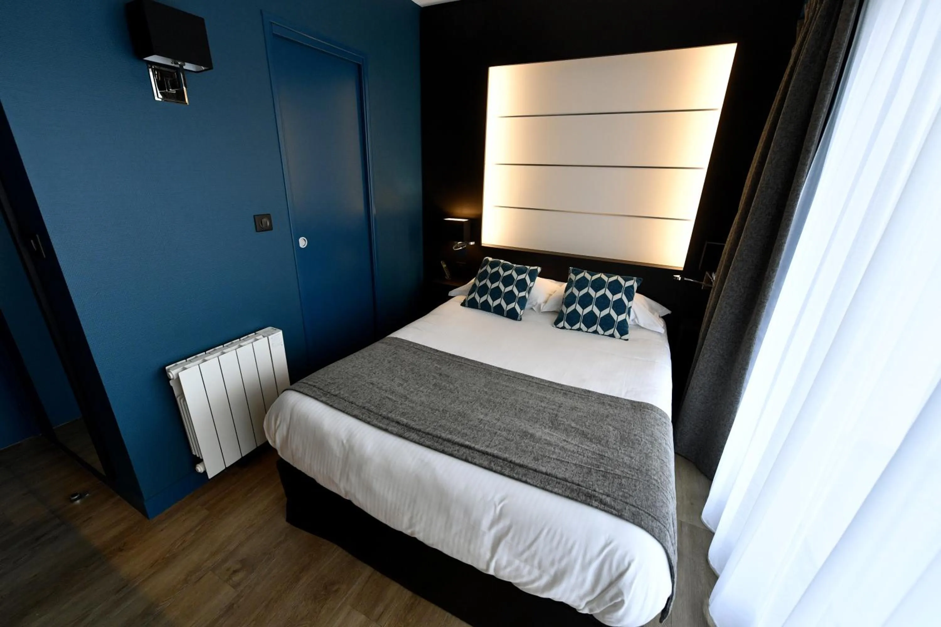 Bed in Hôtel Des Quatrans