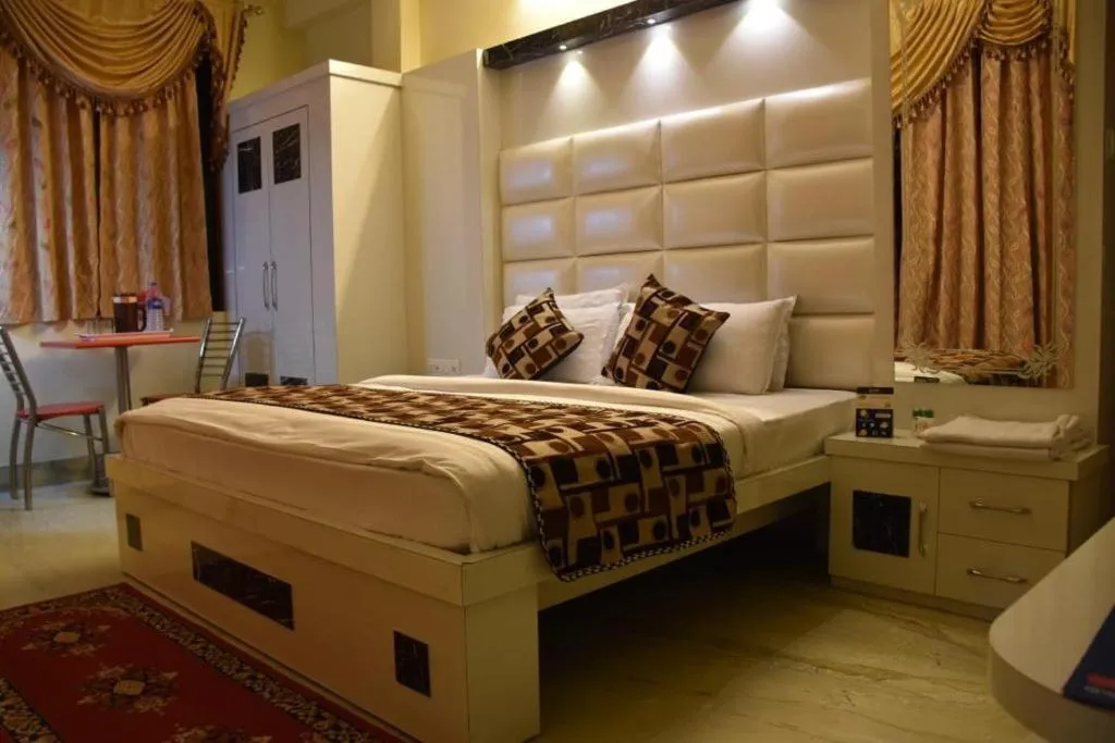 Photo of the whole room, Bed in Ganpati Plaza Hotel