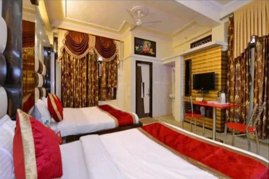 Photo of the whole room, Bed in Ganpati Plaza Hotel