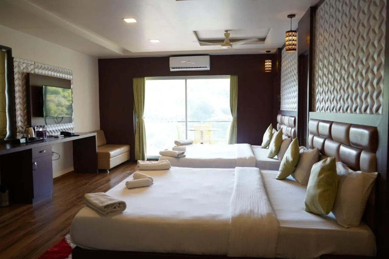 Bed in Khushi Riverside Resort & Spa