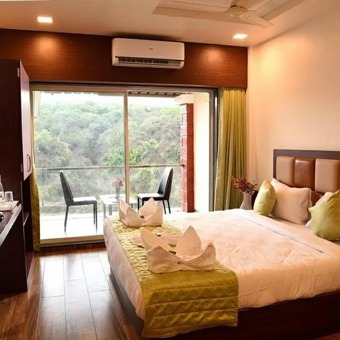 Bed in Khushi Riverside Resort & Spa
