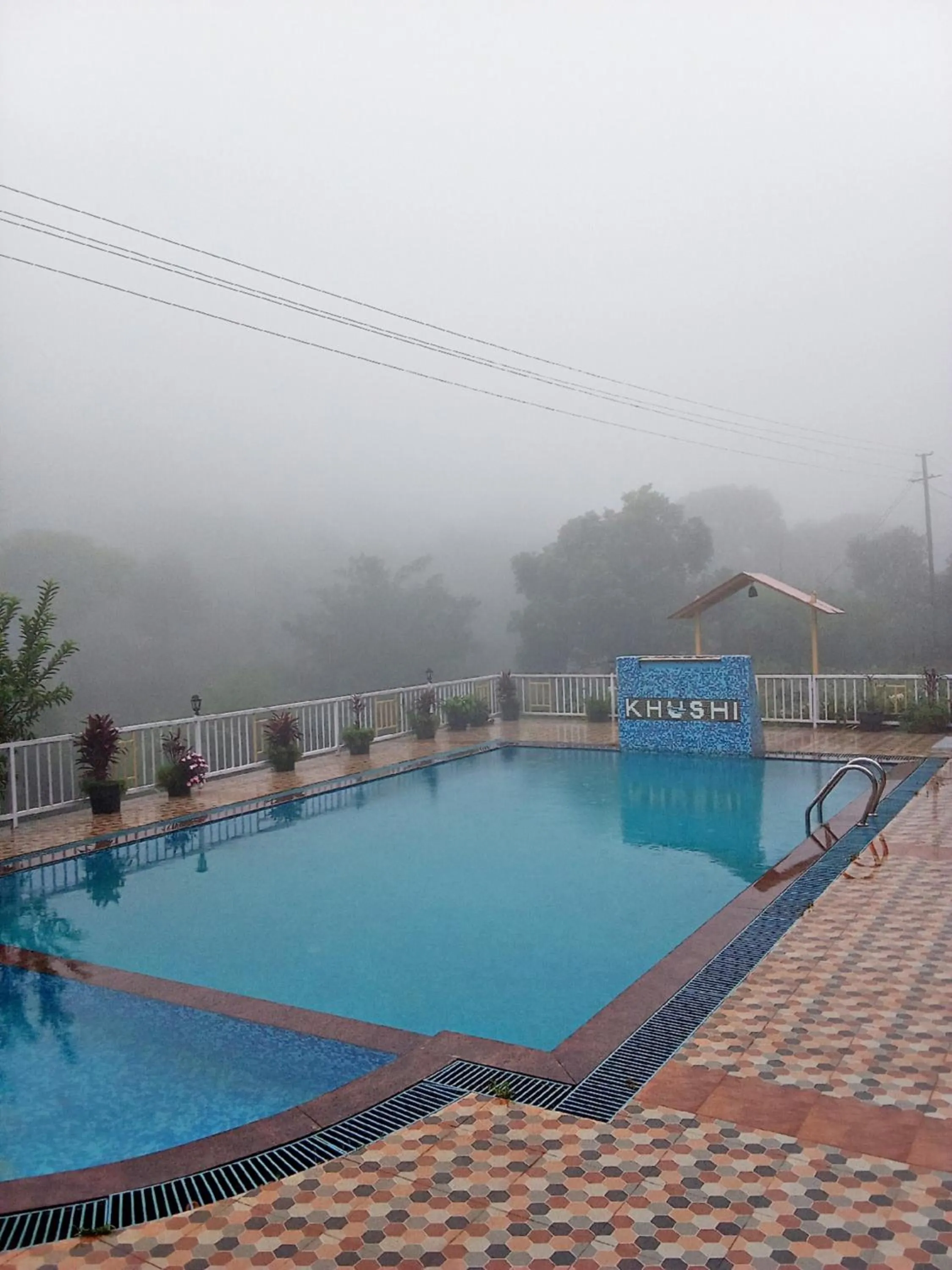 Swimming pool in Khushi Riverside Resort & Spa