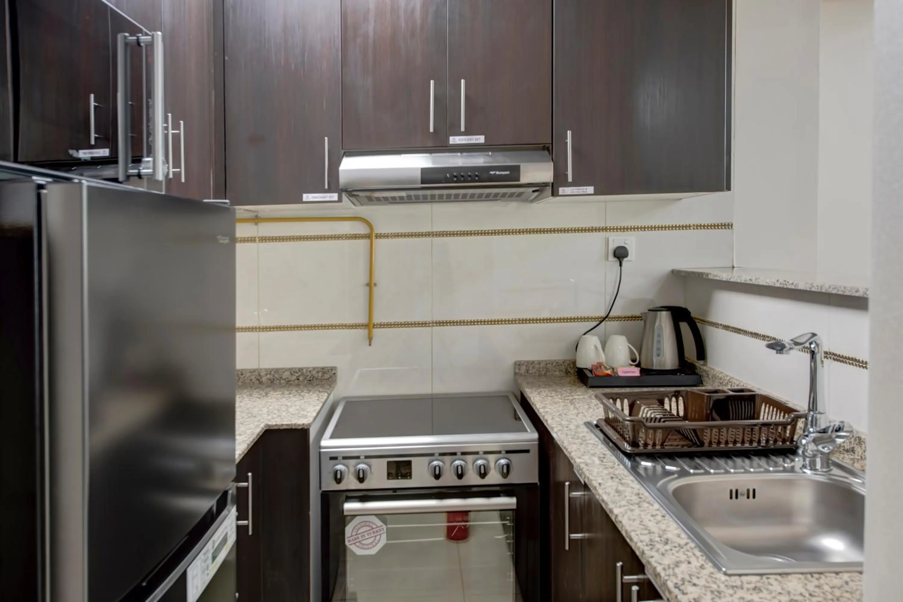 Kitchen or kitchenette in Royal Regency Suites Marina