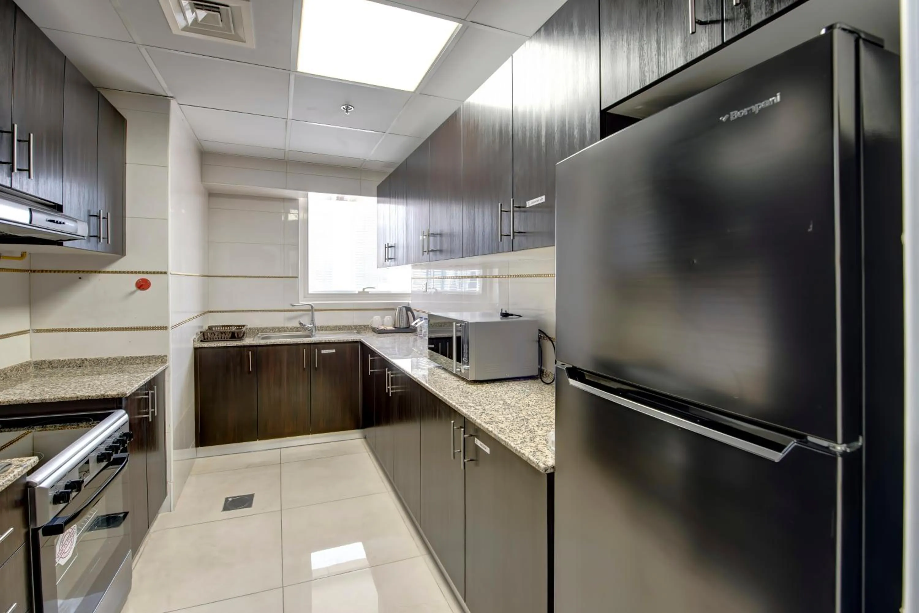 Kitchen or kitchenette in Royal Regency Suites Marina