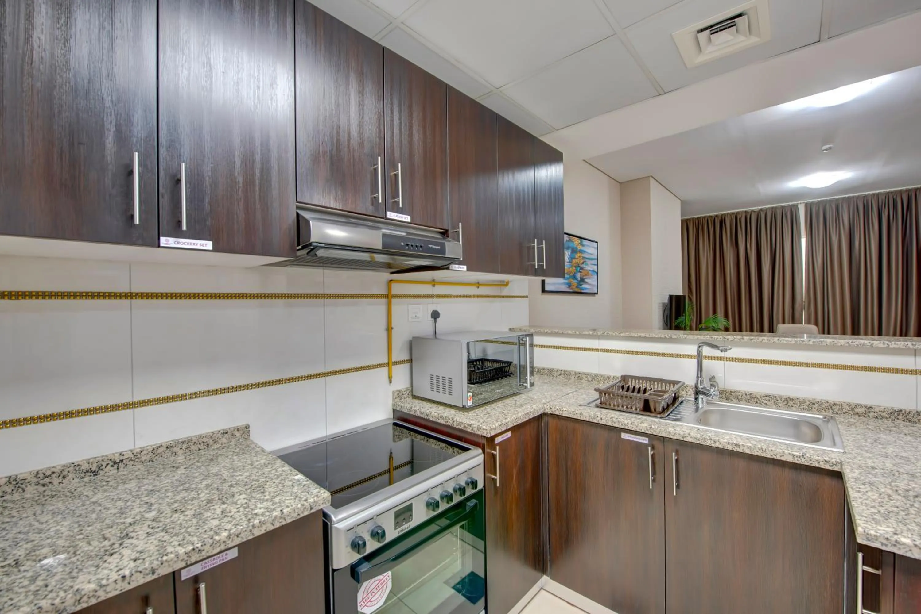 Kitchen or kitchenette in Royal Regency Suites Marina