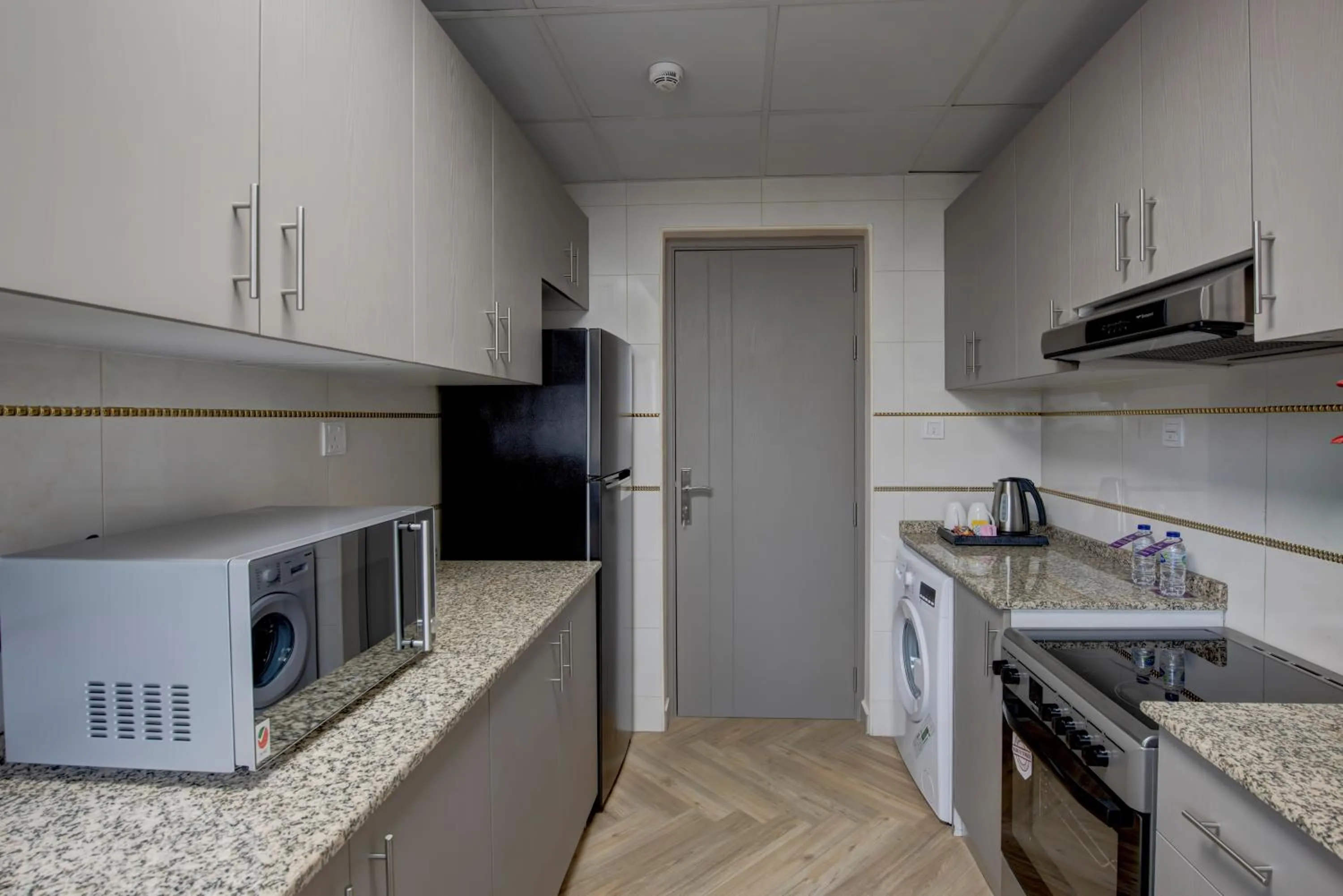 Kitchen or kitchenette in Royal Regency Suites Marina