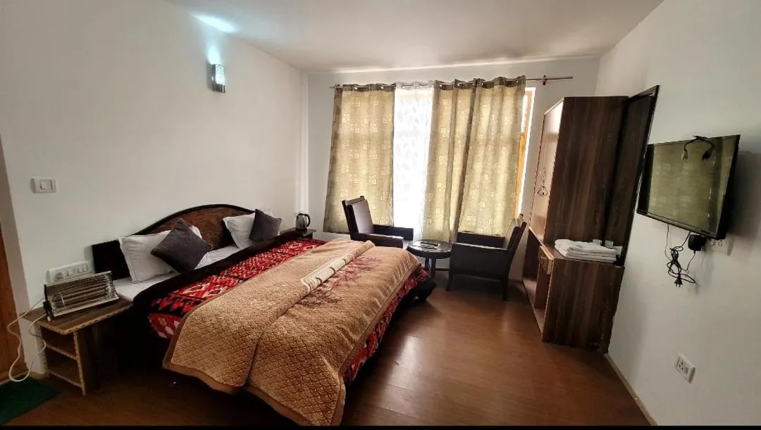 Bed in Hotel Malik Residency