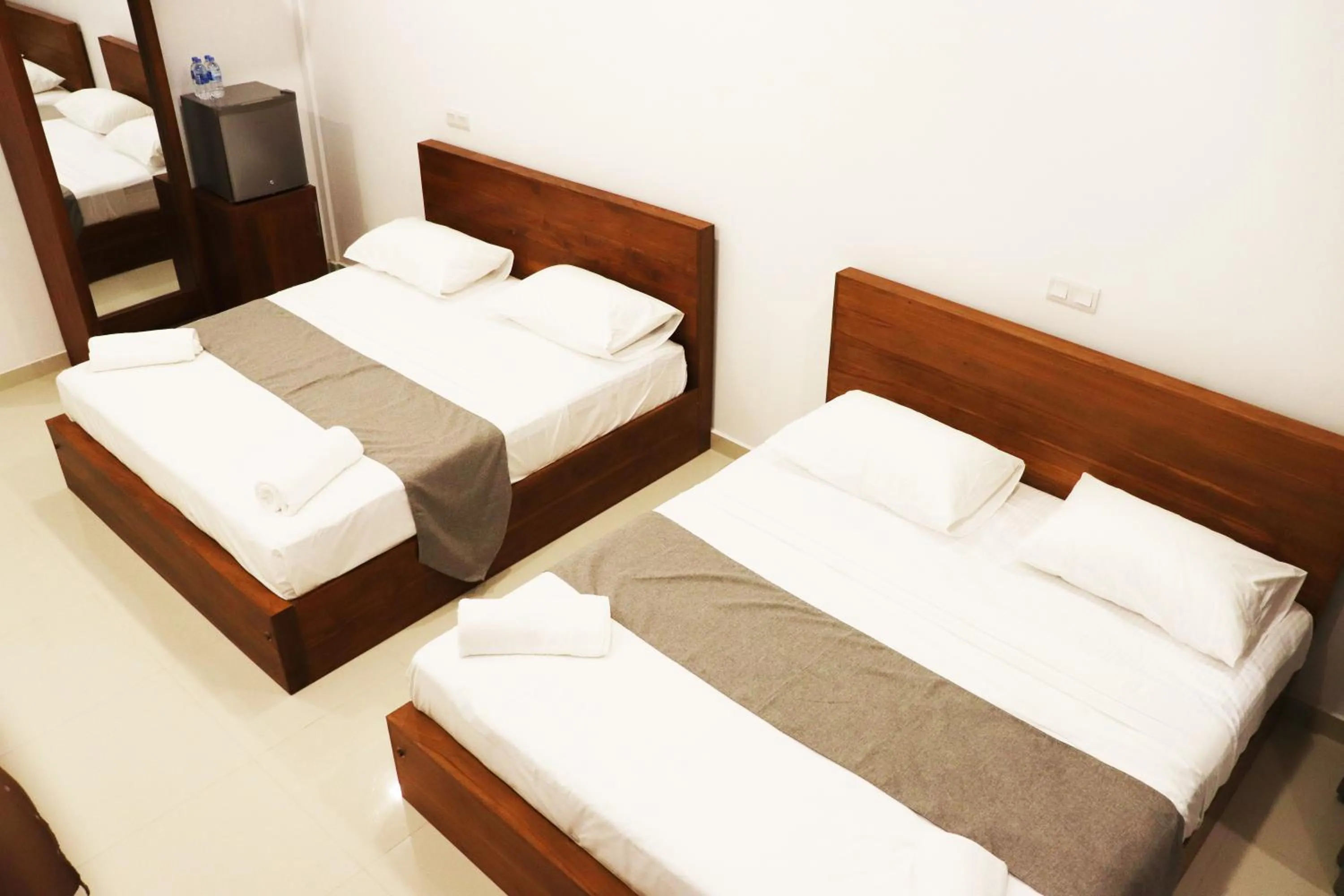 Bed in Marakolliya Beach Resort