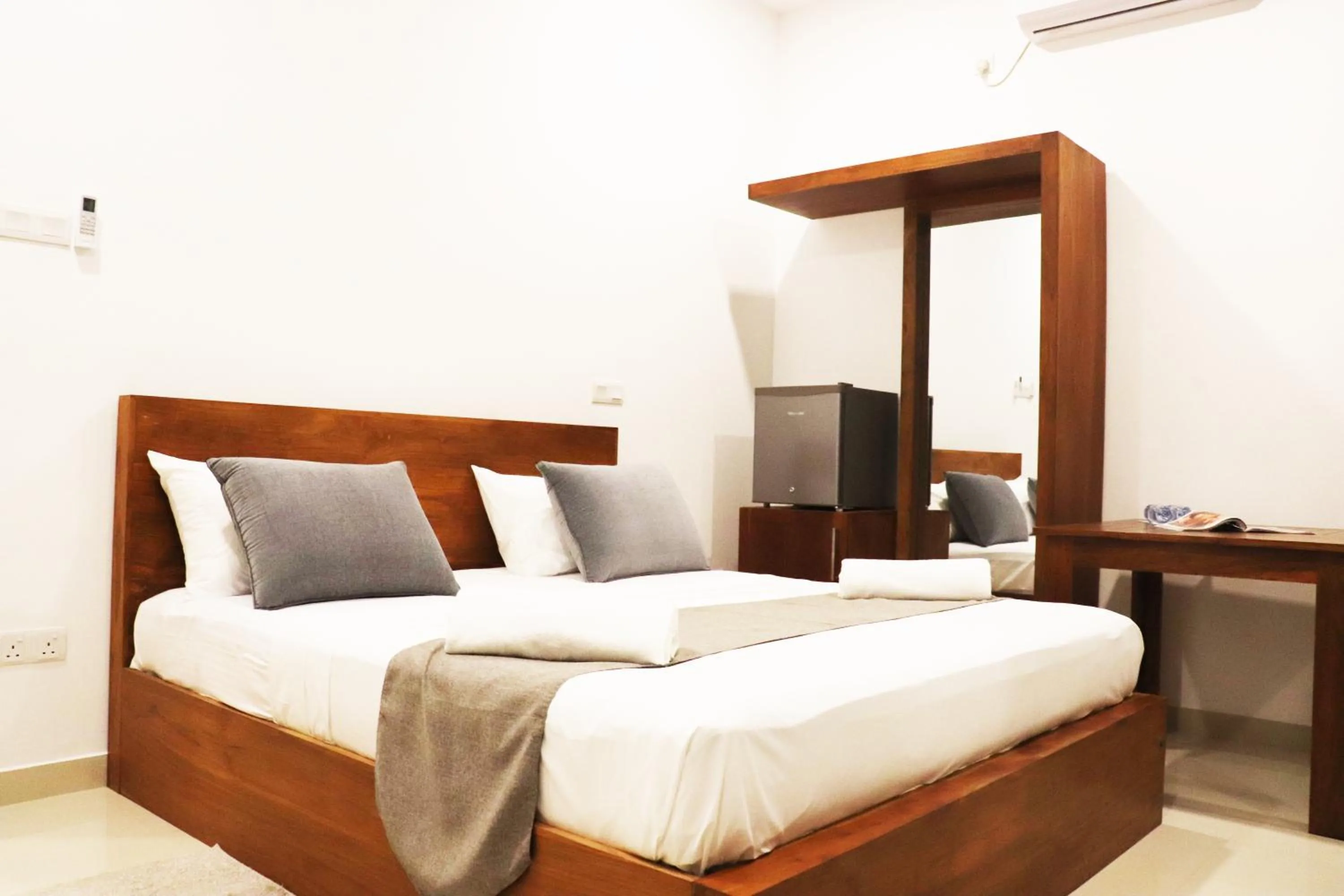 Bed in Marakolliya Beach Resort