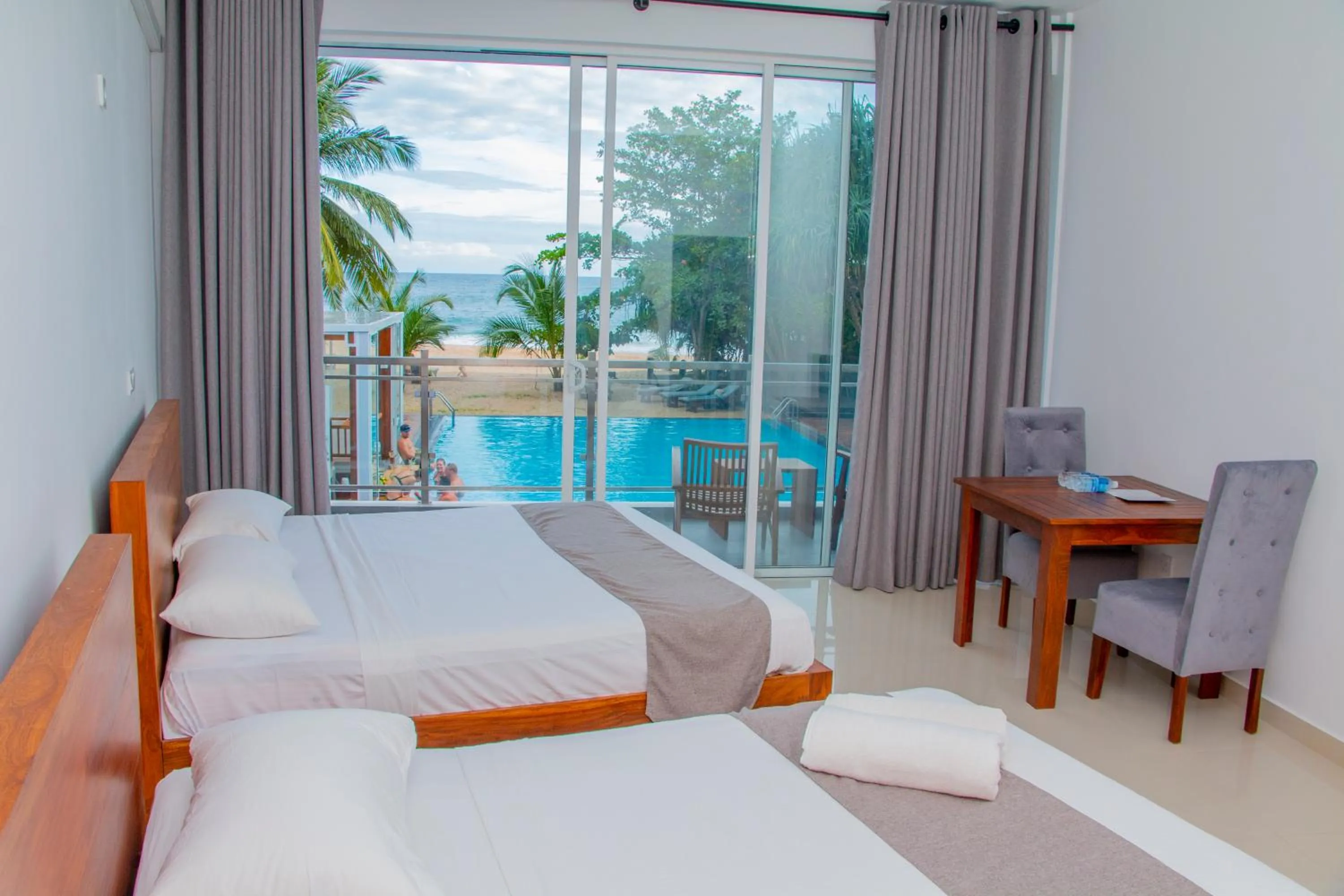 Bed in Marakolliya Beach Resort