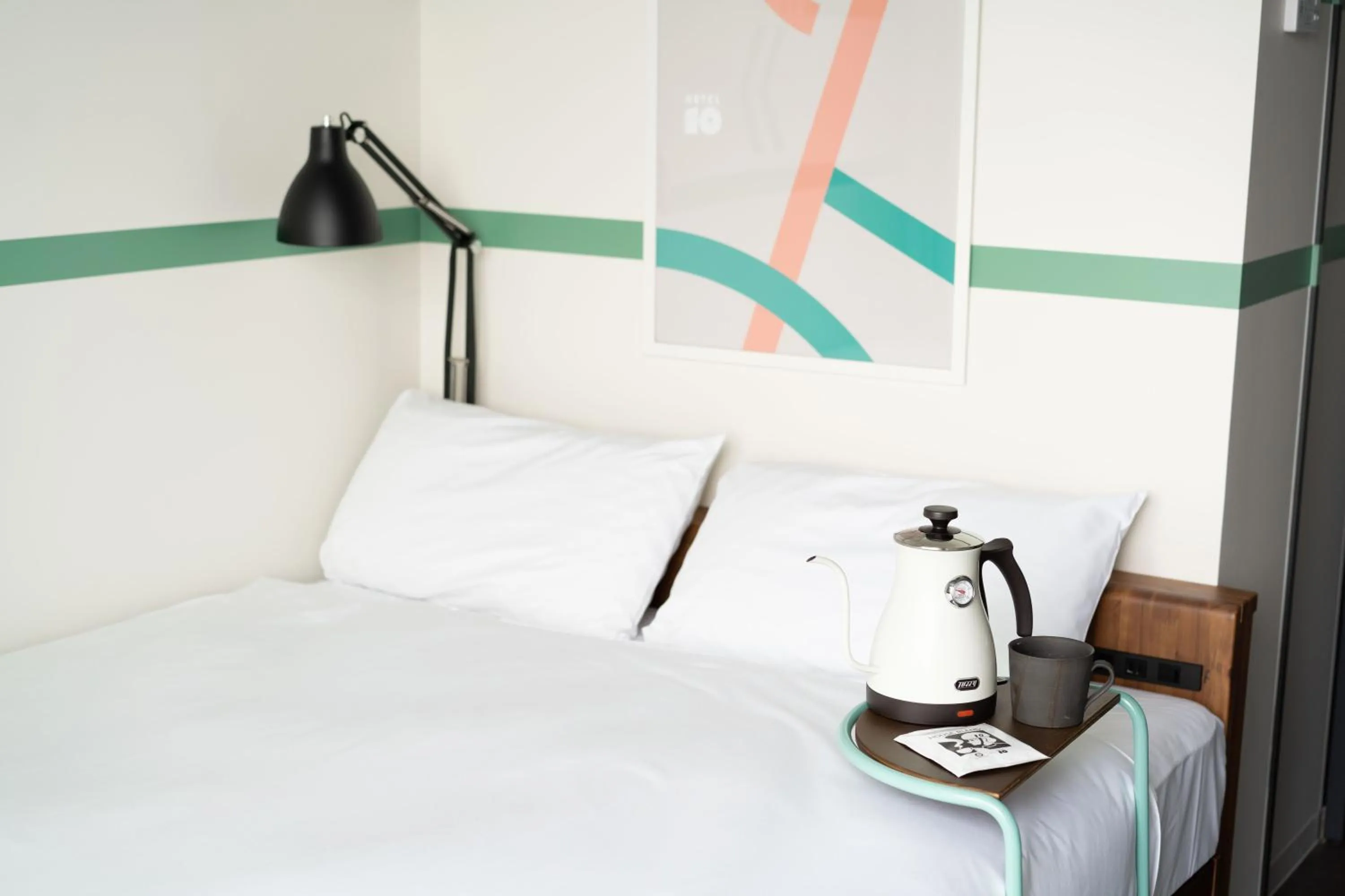 Bedroom, Bed in SETOUCHI KEIRIN HOTEL 10 by Onko Chishin