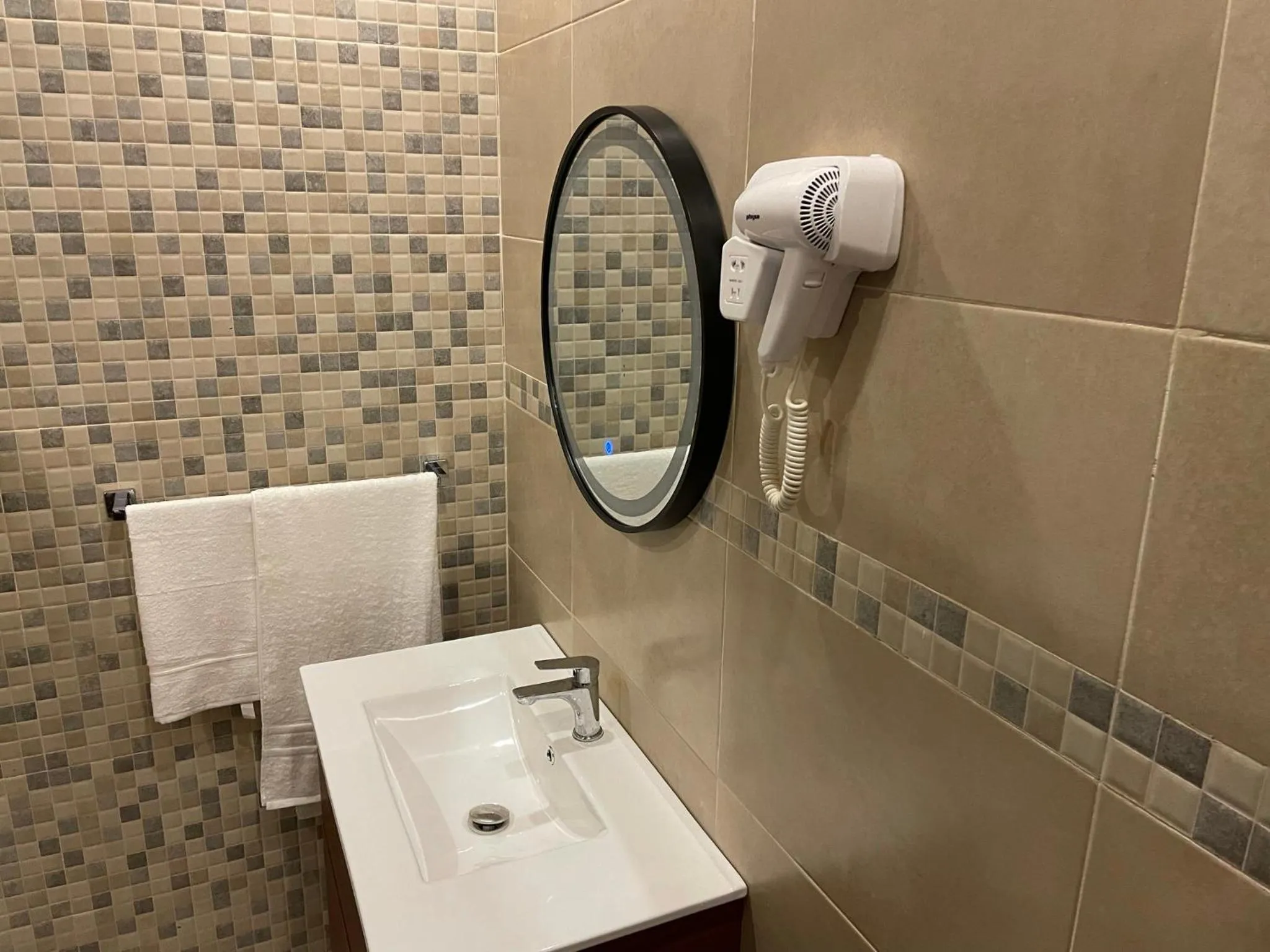 Shower in HOTEL LES ARCADES