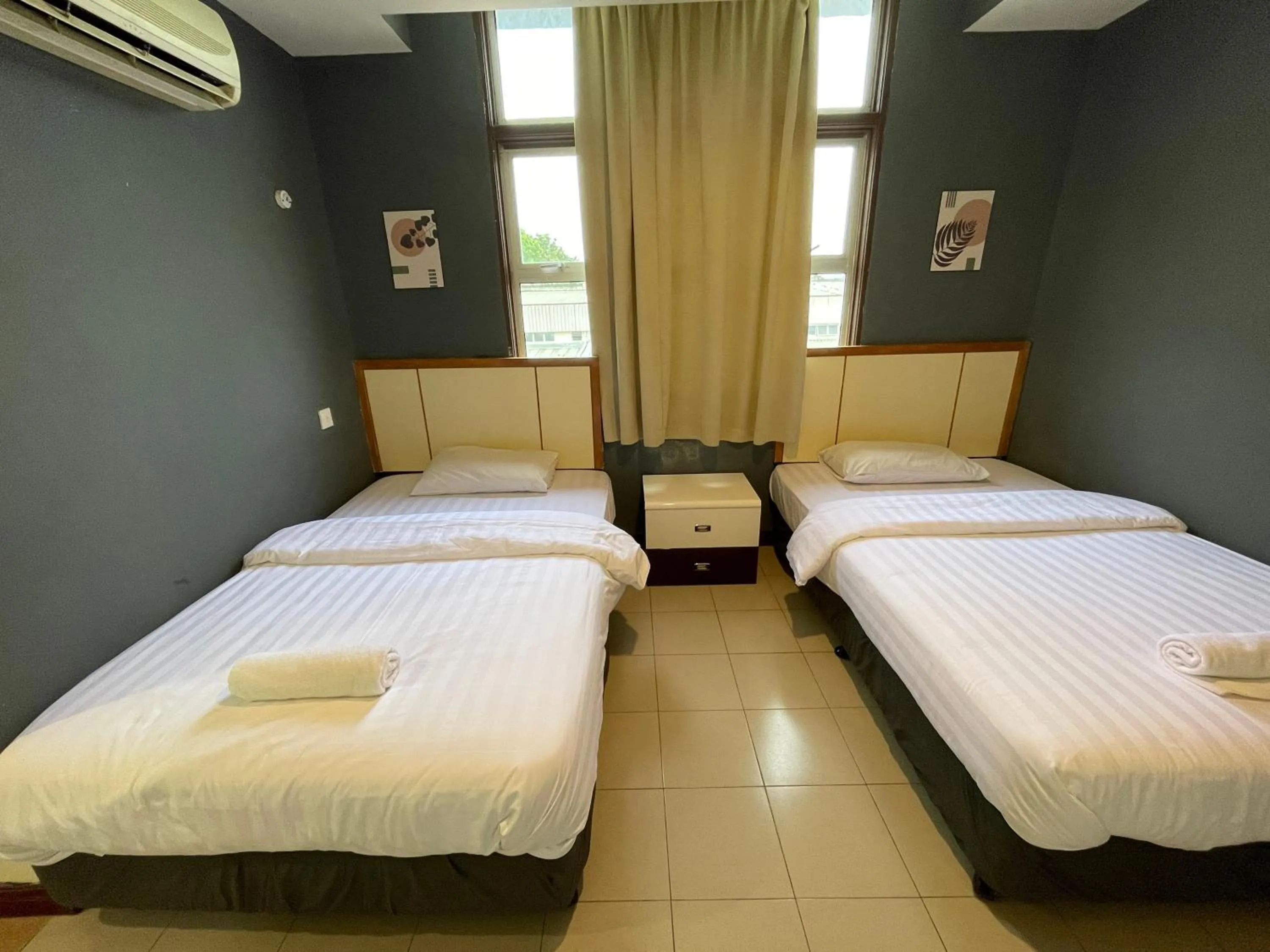 Bed in Fresh Hotel Falim