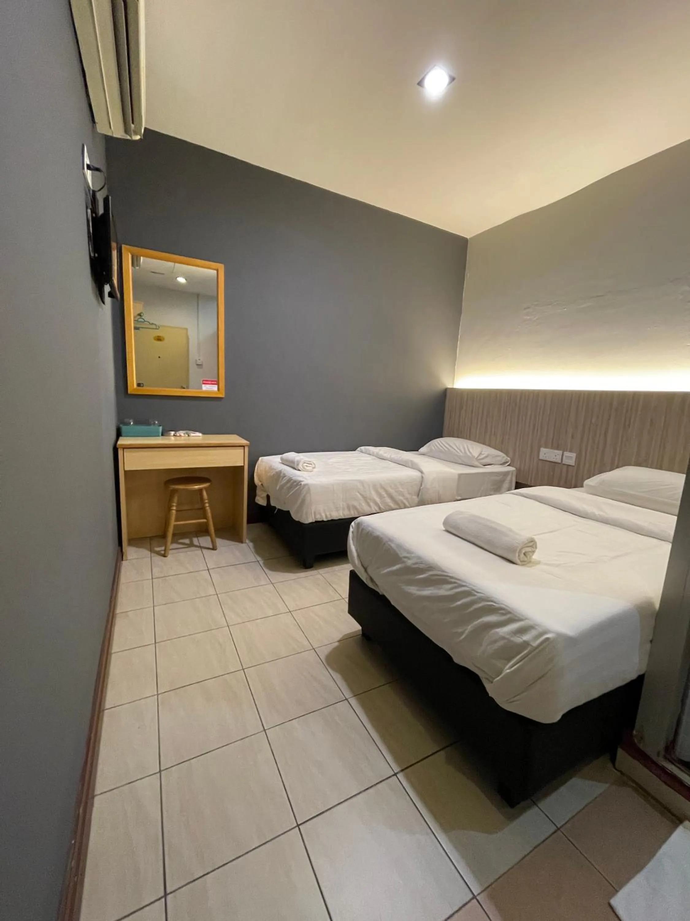 Bed in Fresh Hotel Falim