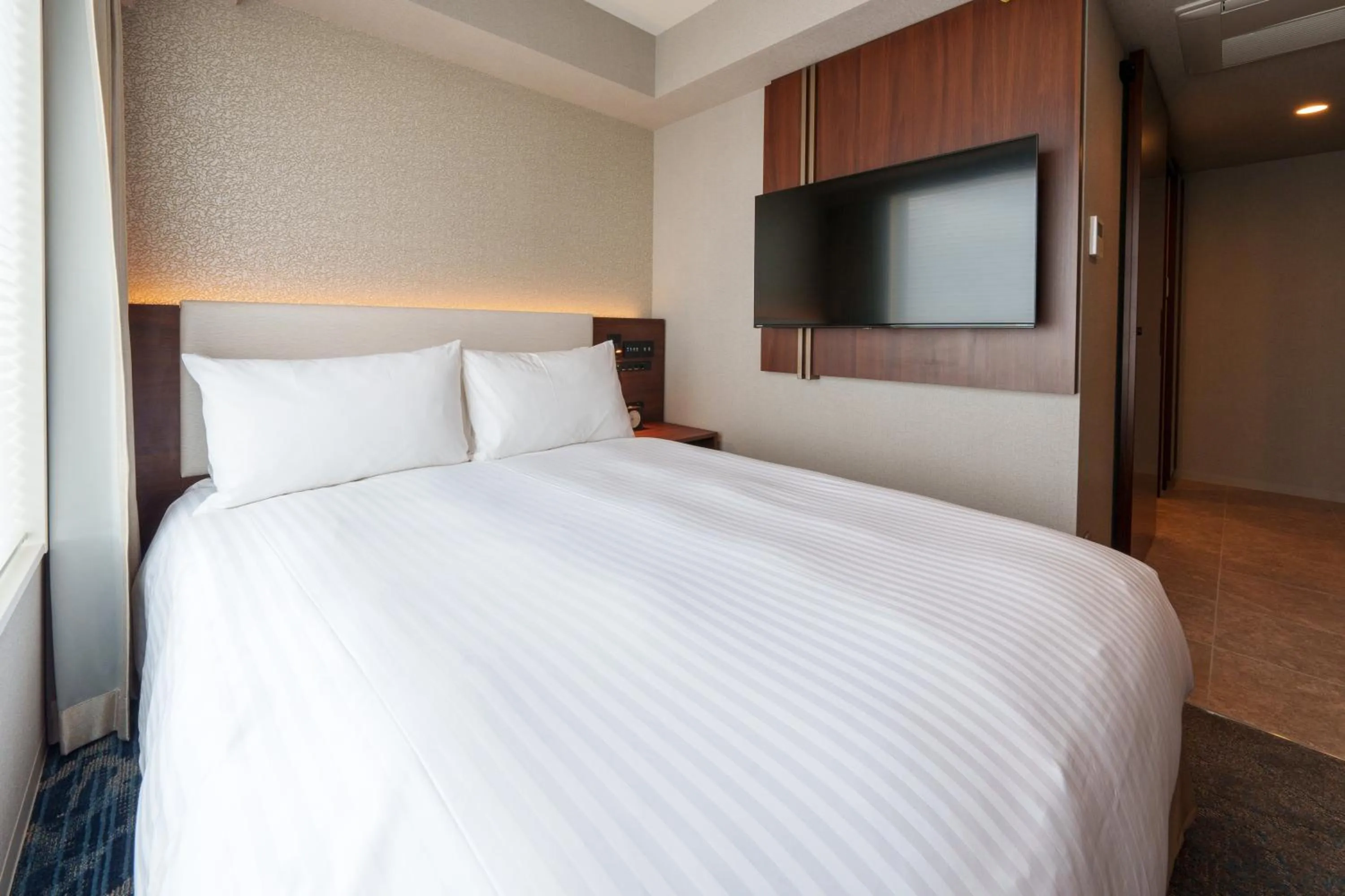 Bed in Hotel GrandConsort Naha