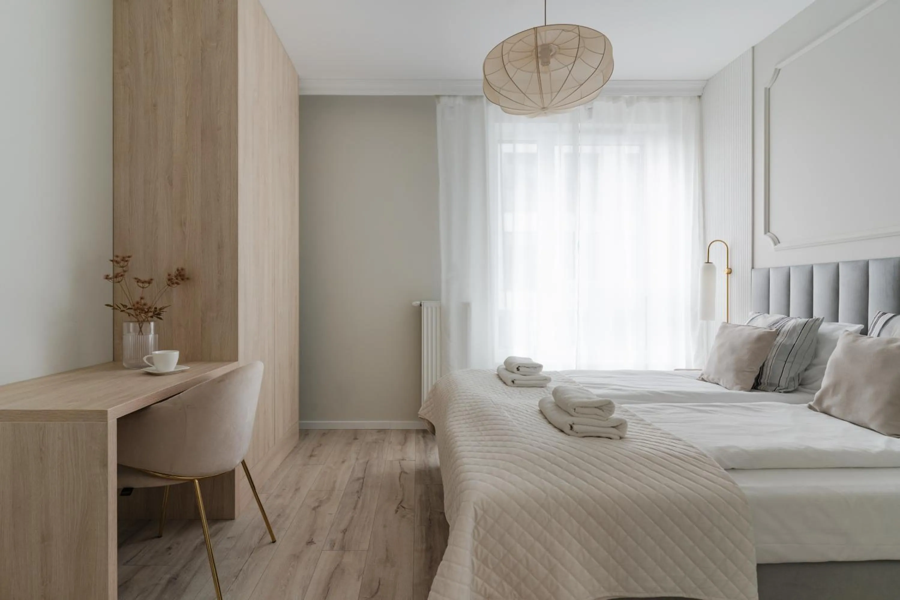 Bed in Symphony Modern Tower Apartamenty