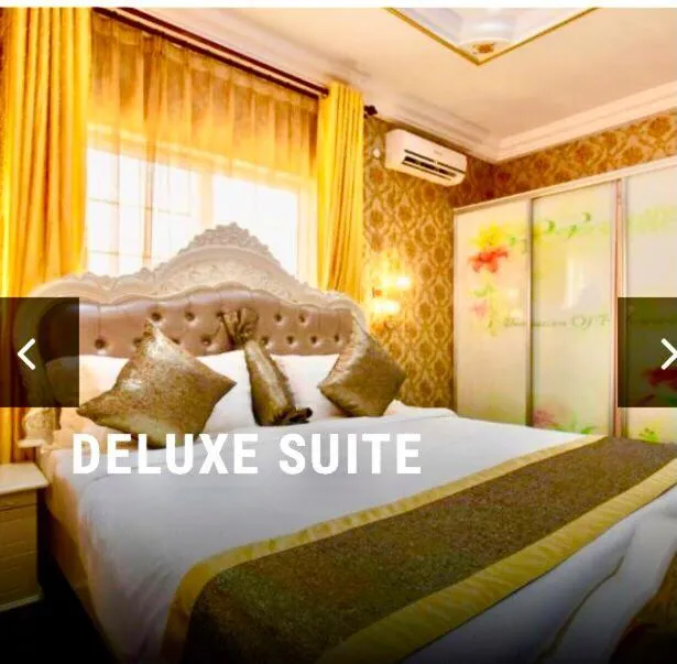 Bedroom in Amazing Grace Hotel & Suites