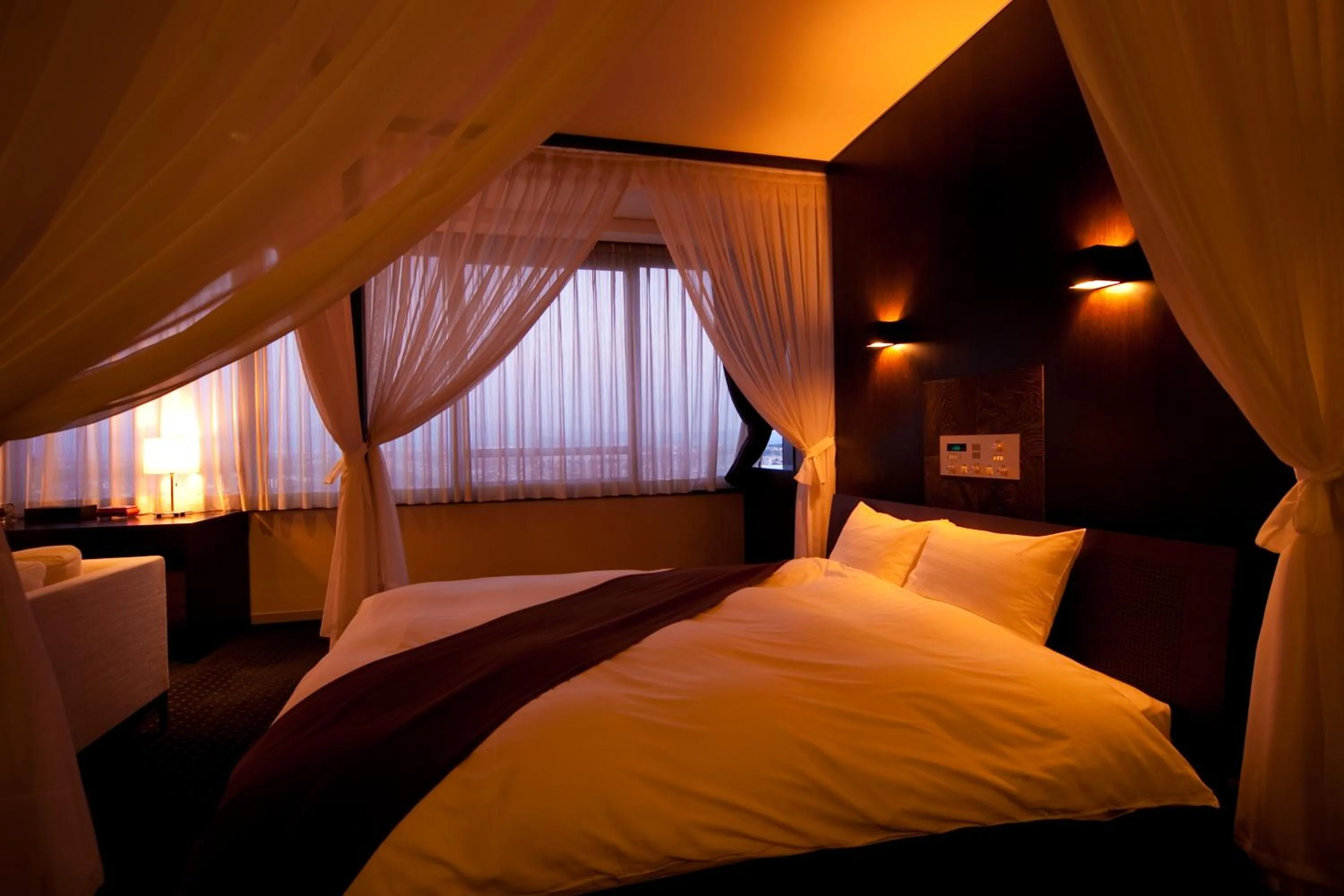 Bed in Kikunan Onsen Yubel Hotel