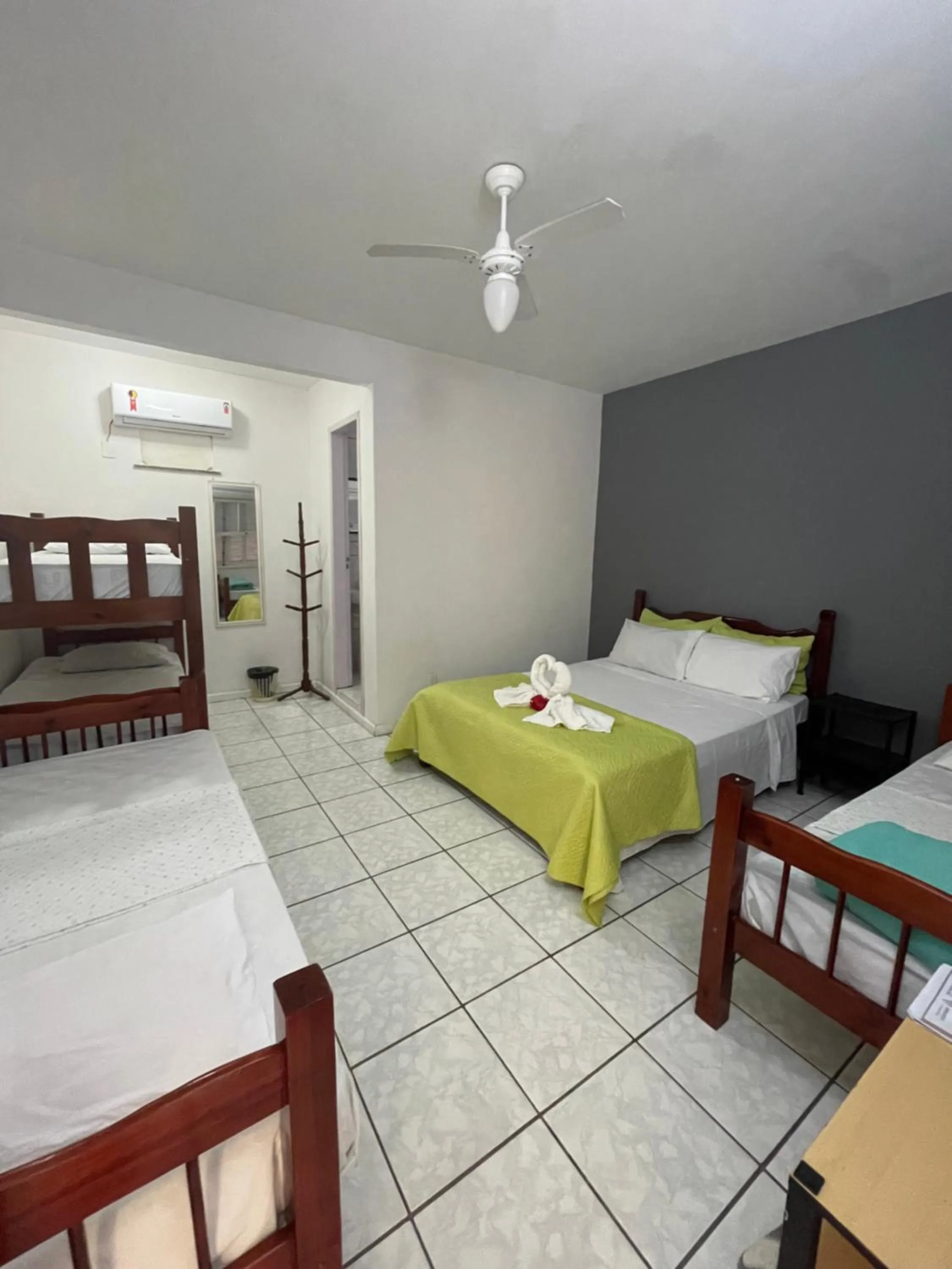 Bed in Pousada Frezza Mergulho