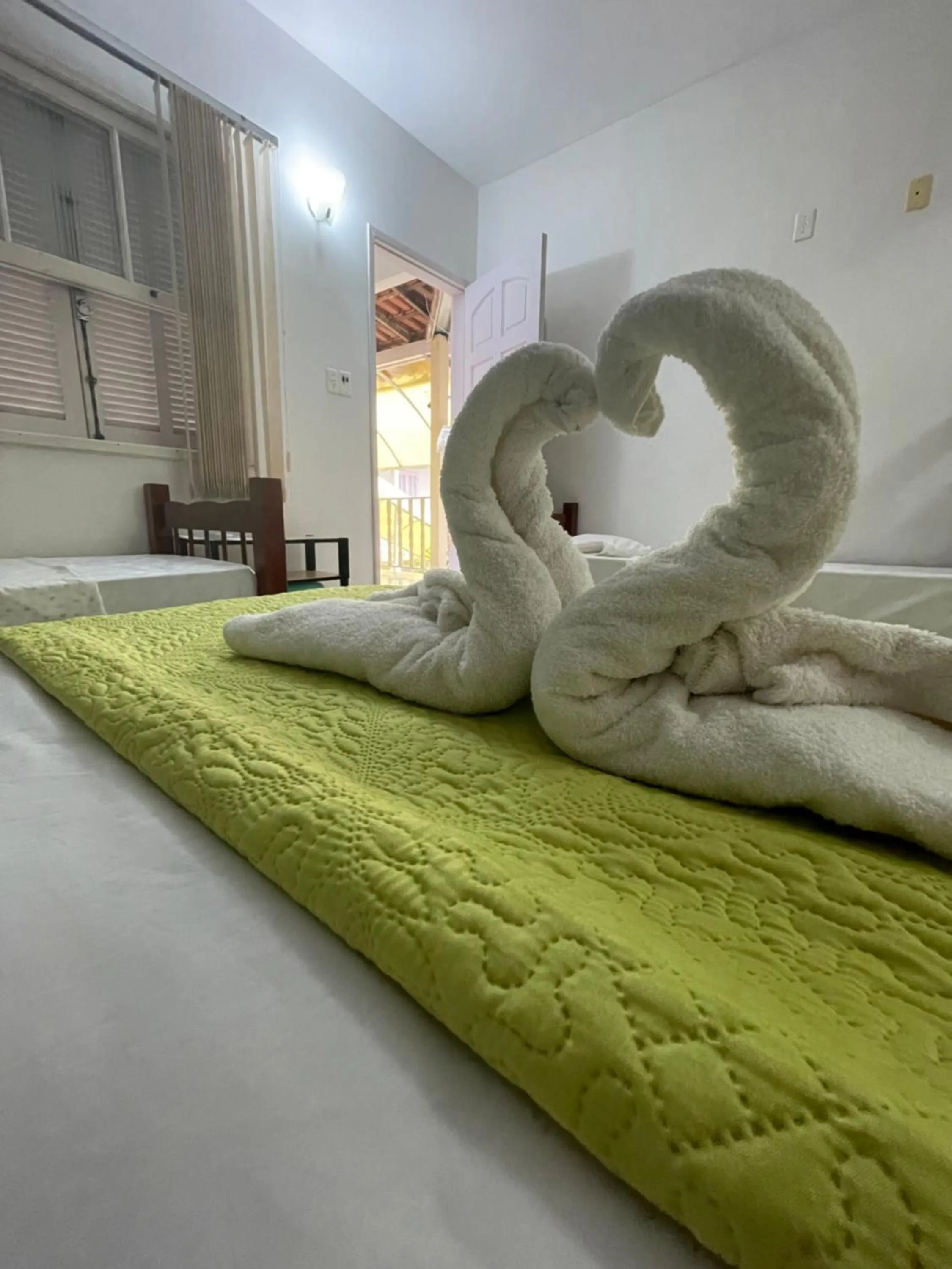 Bed in Pousada Frezza Mergulho