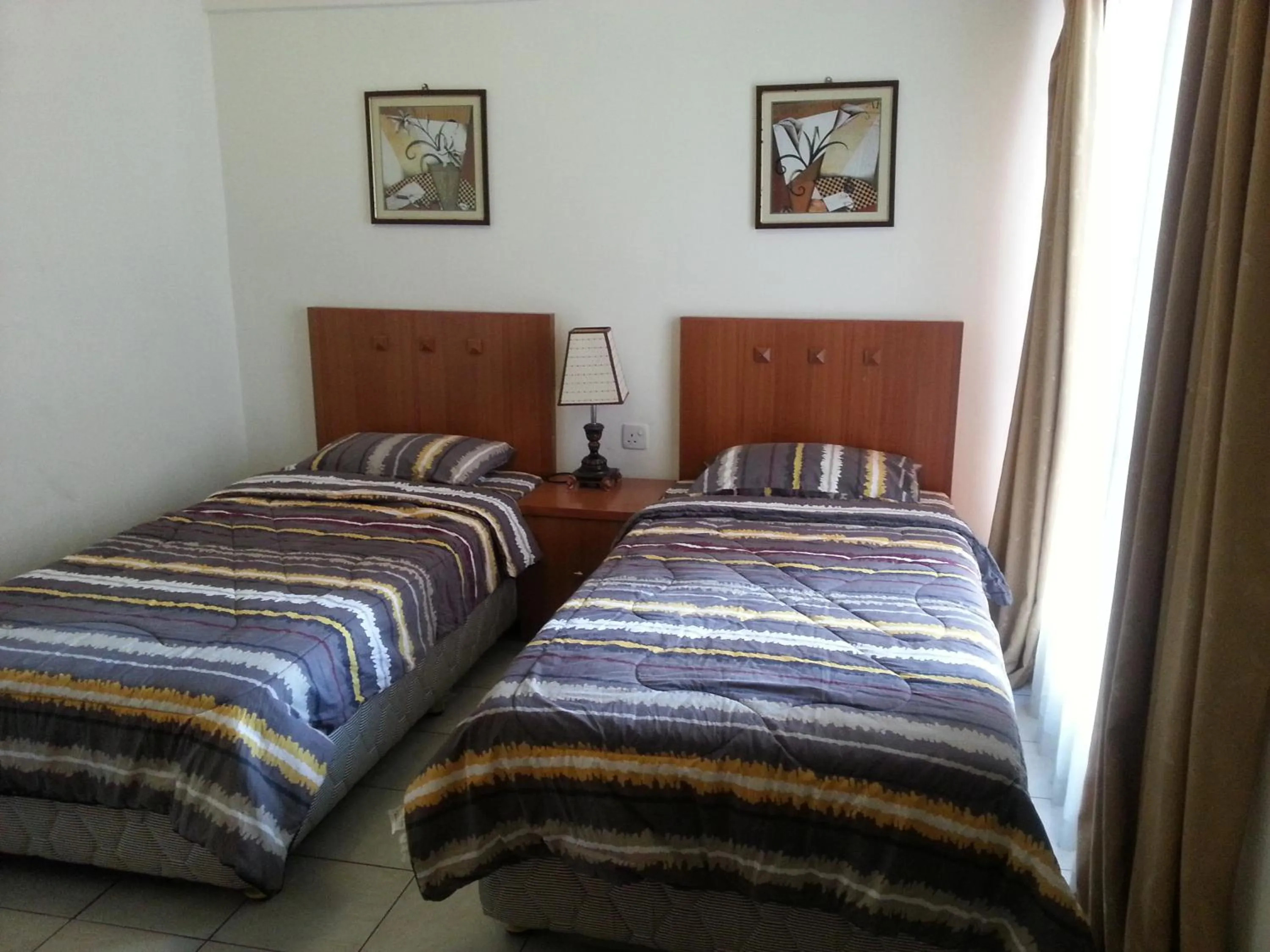 Photo of the whole room, Bed in Dorcas Service Apartment - Marina Court