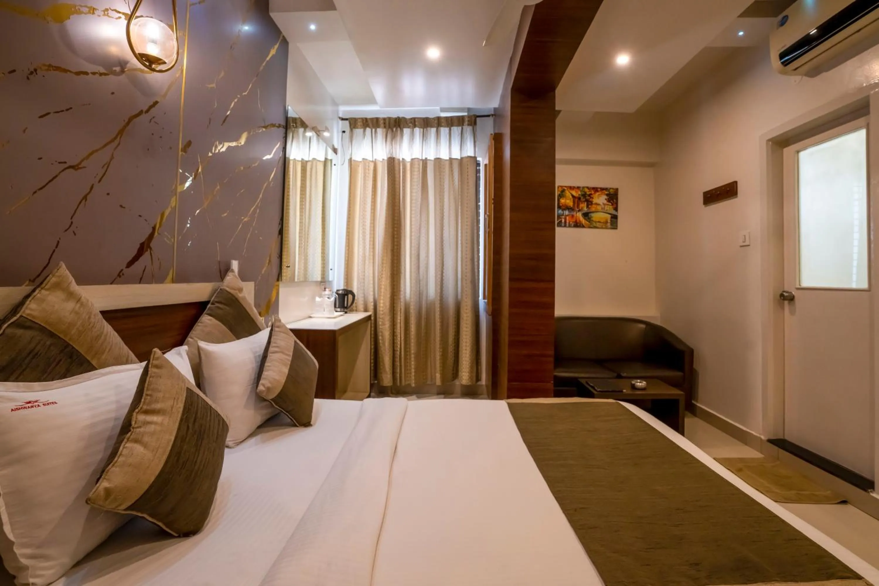 Bed in Aishwarya Suites