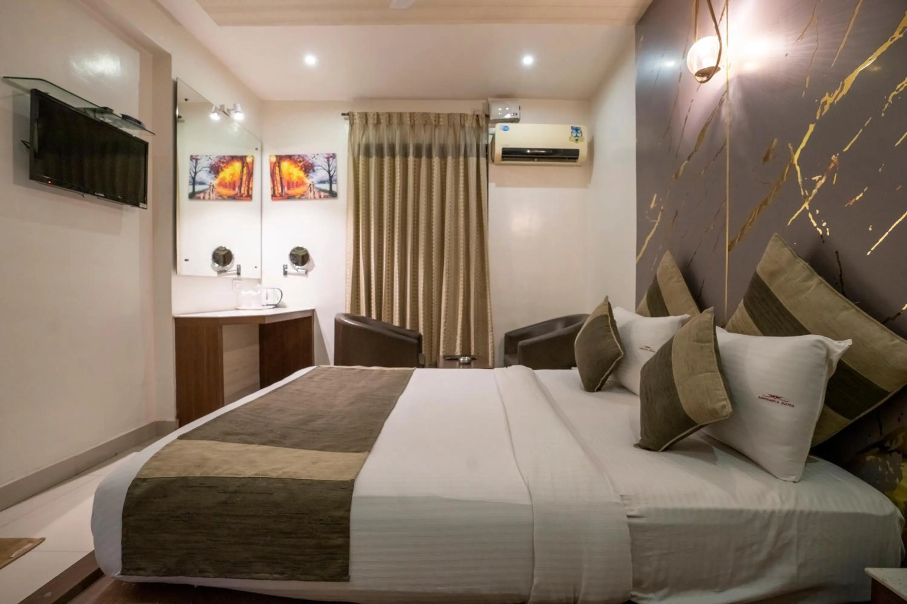 Bed in Aishwarya Suites