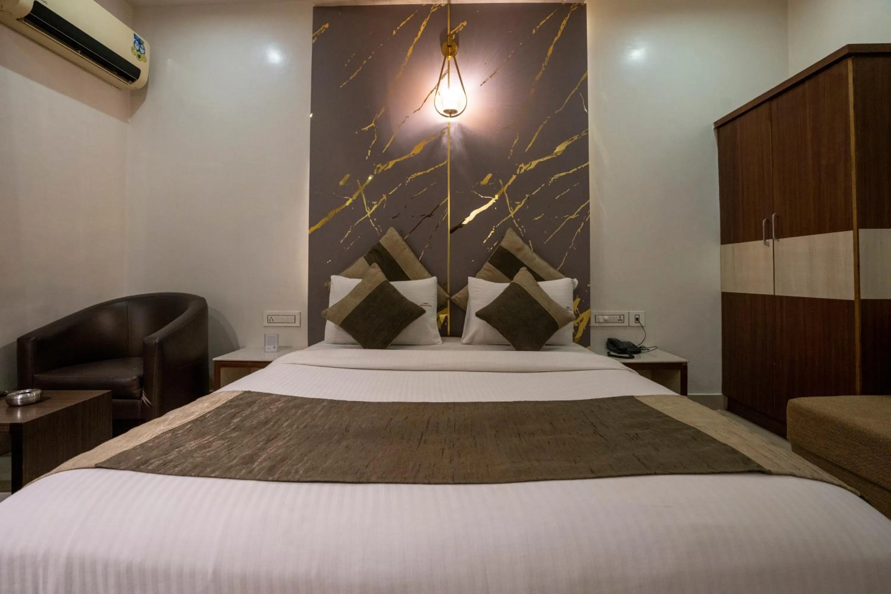 Bed in Aishwarya Suites