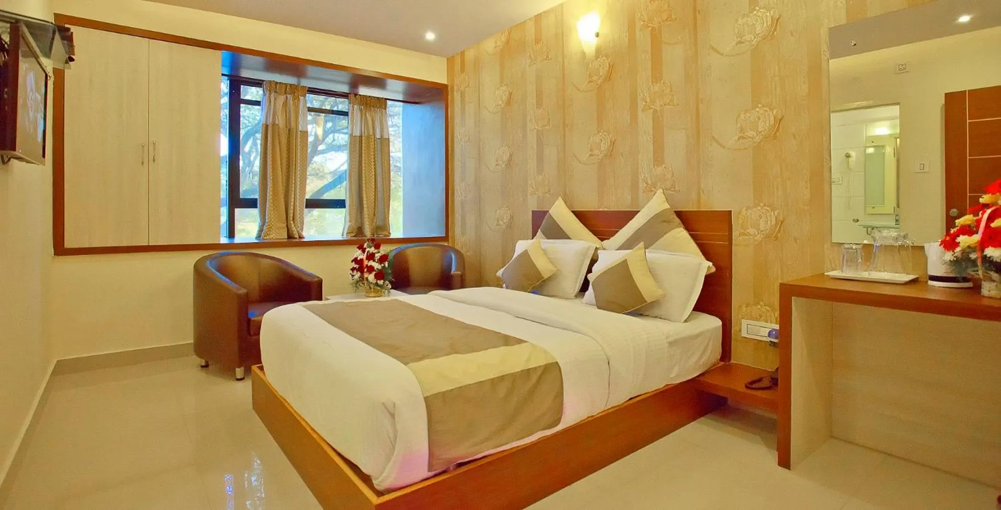 Bed in Aishwarya Suites