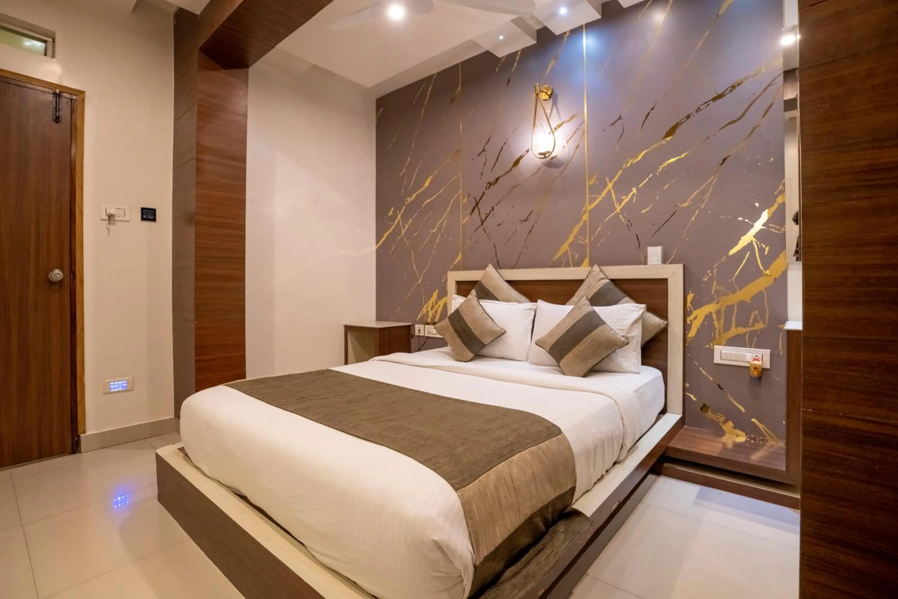 Bed in Aishwarya Suites