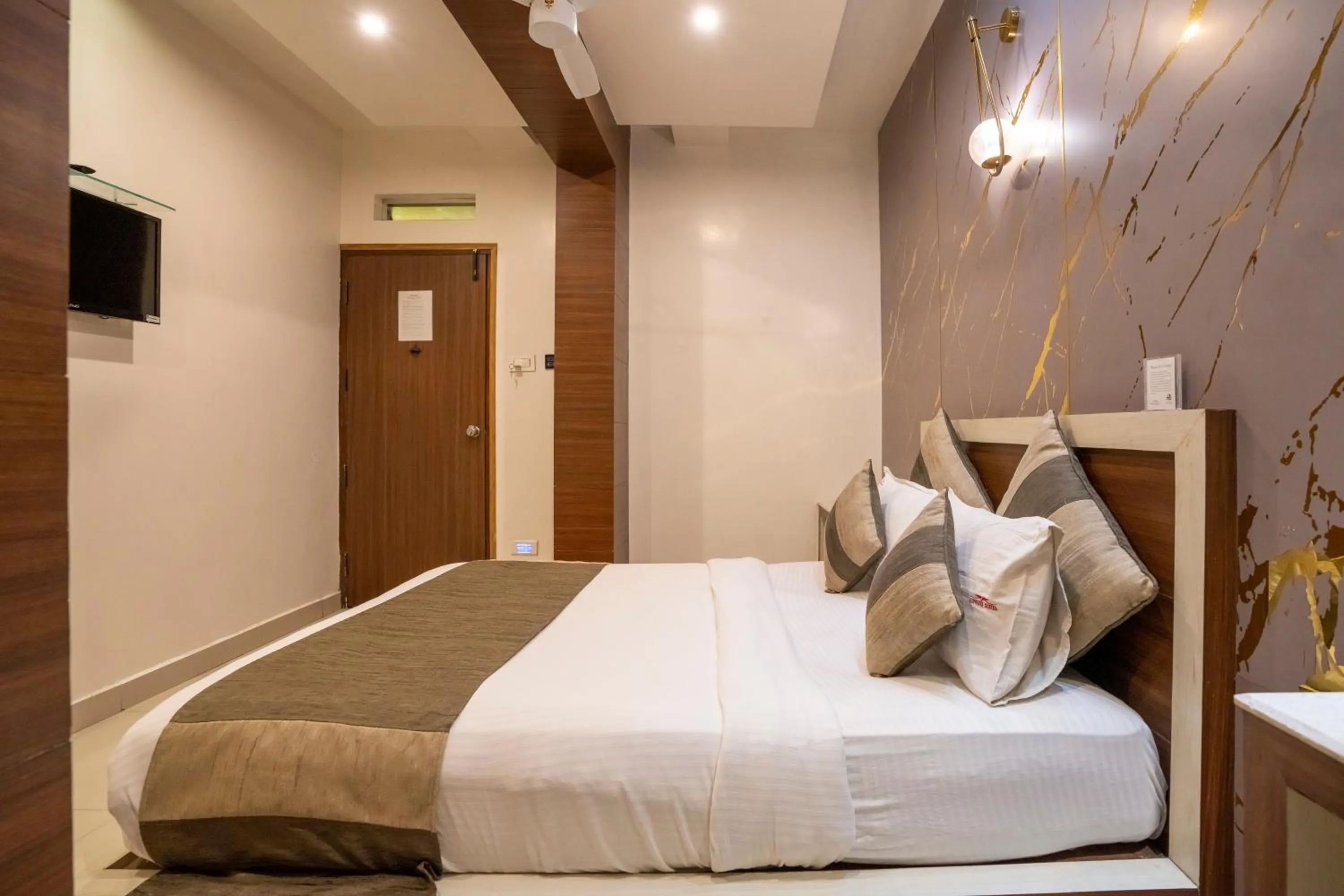 Bed in Aishwarya Suites