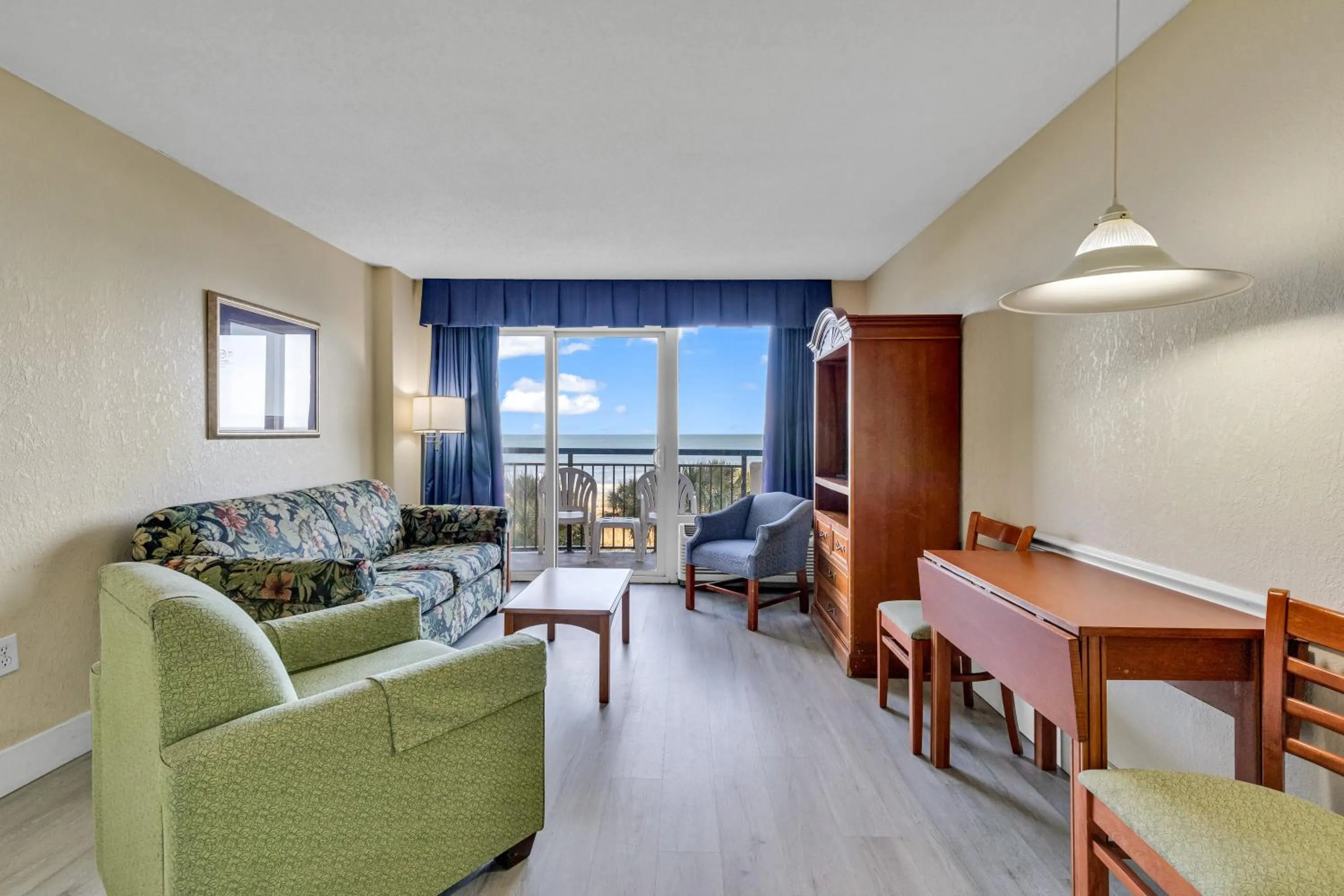 Living room in Oceanfront Boardwalk Condo w Private Balcony and Beach