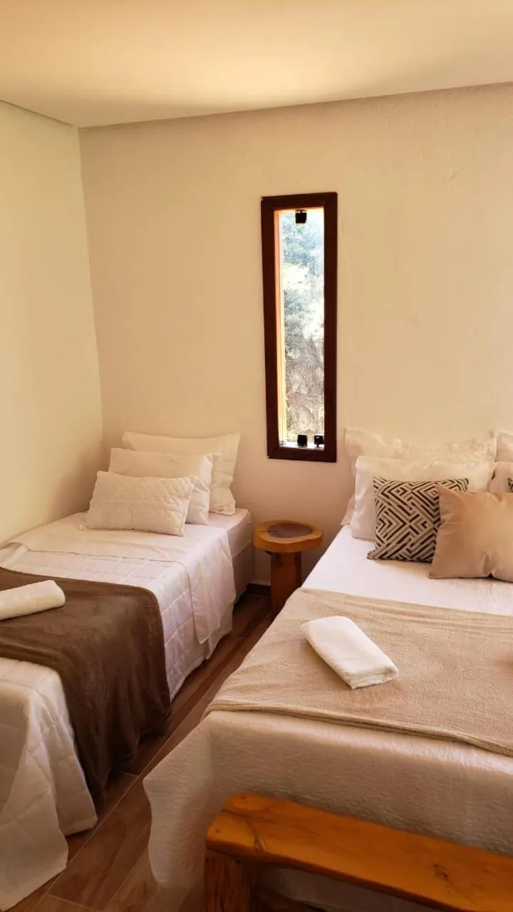 Bed in Pousada Canto das Cachoeiras
