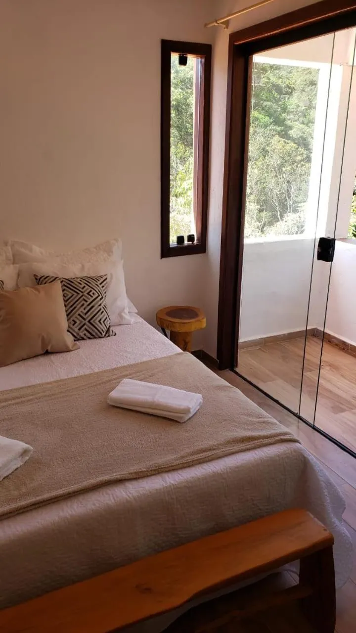 Bed in Pousada Canto das Cachoeiras