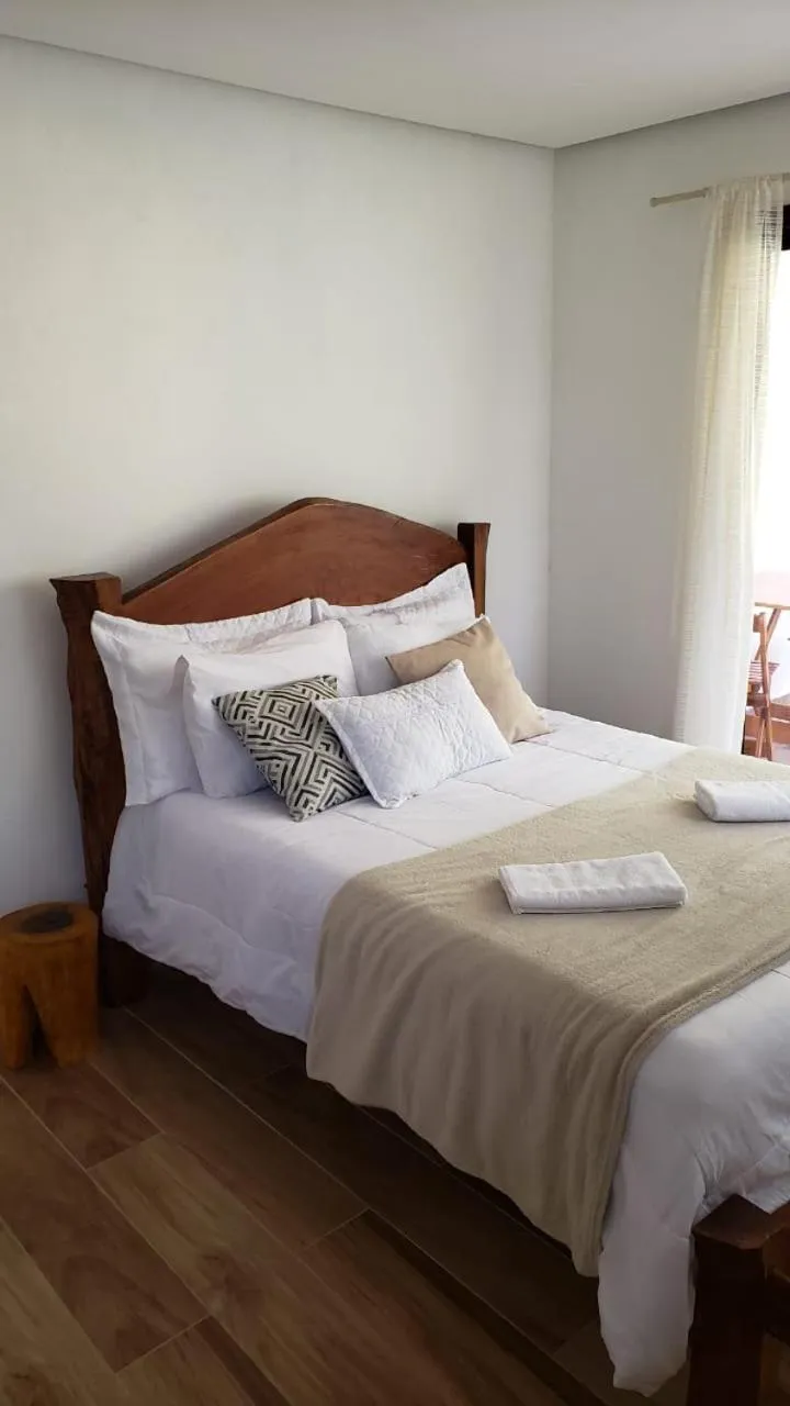 Bed in Pousada Canto das Cachoeiras