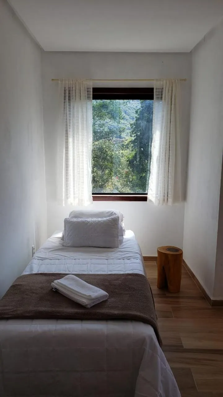 Bed in Pousada Canto das Cachoeiras