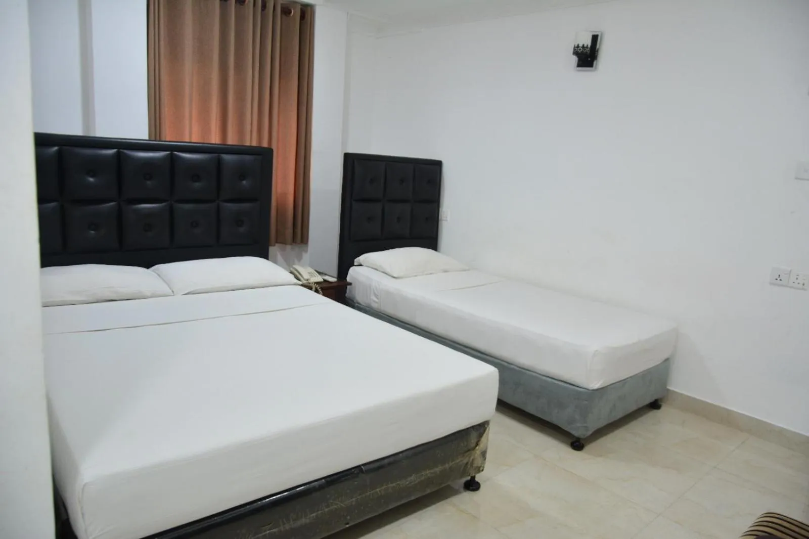 Bed in Saasha City Hotel