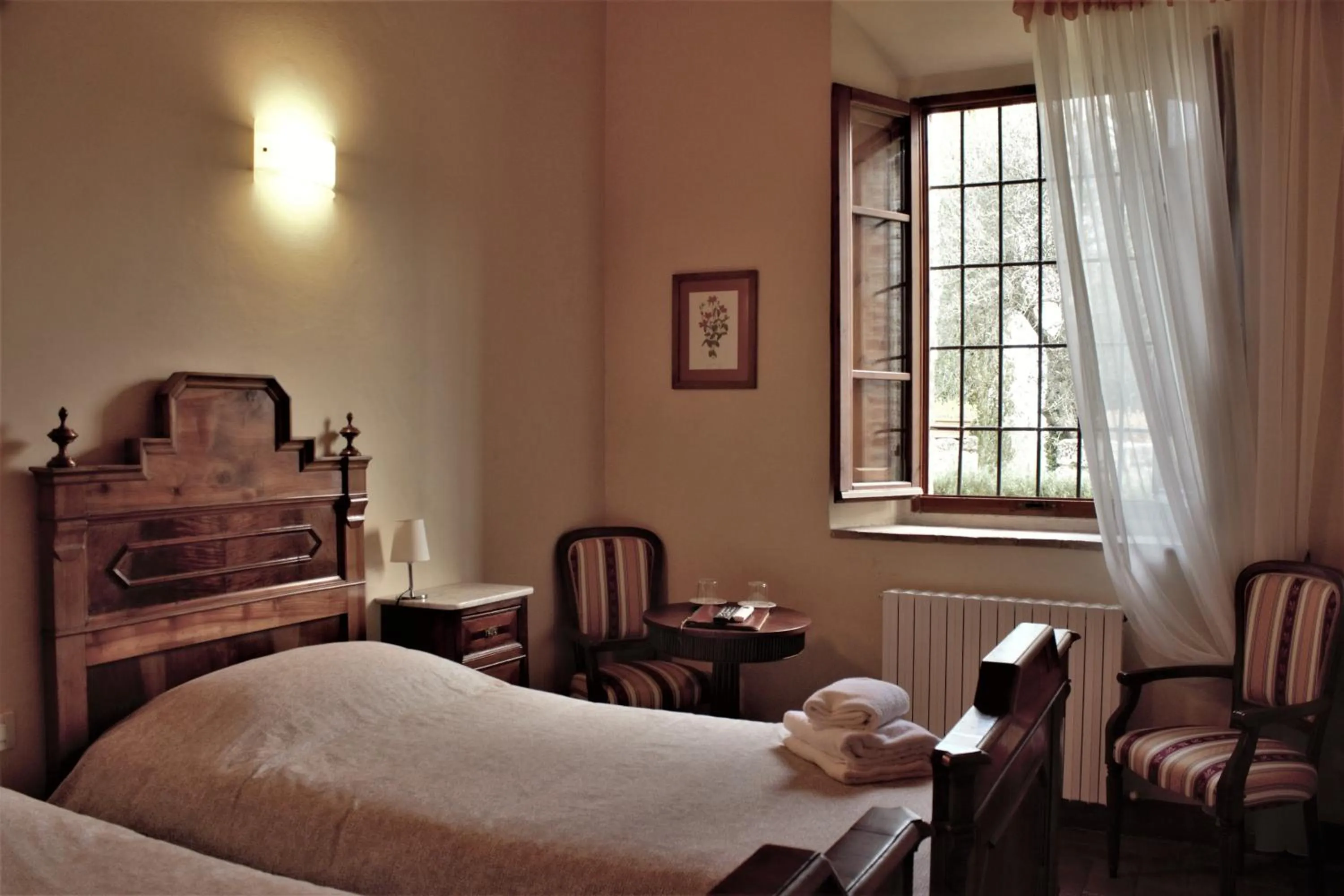 Photo of the whole room, Bed in Relais CastelBigozzi