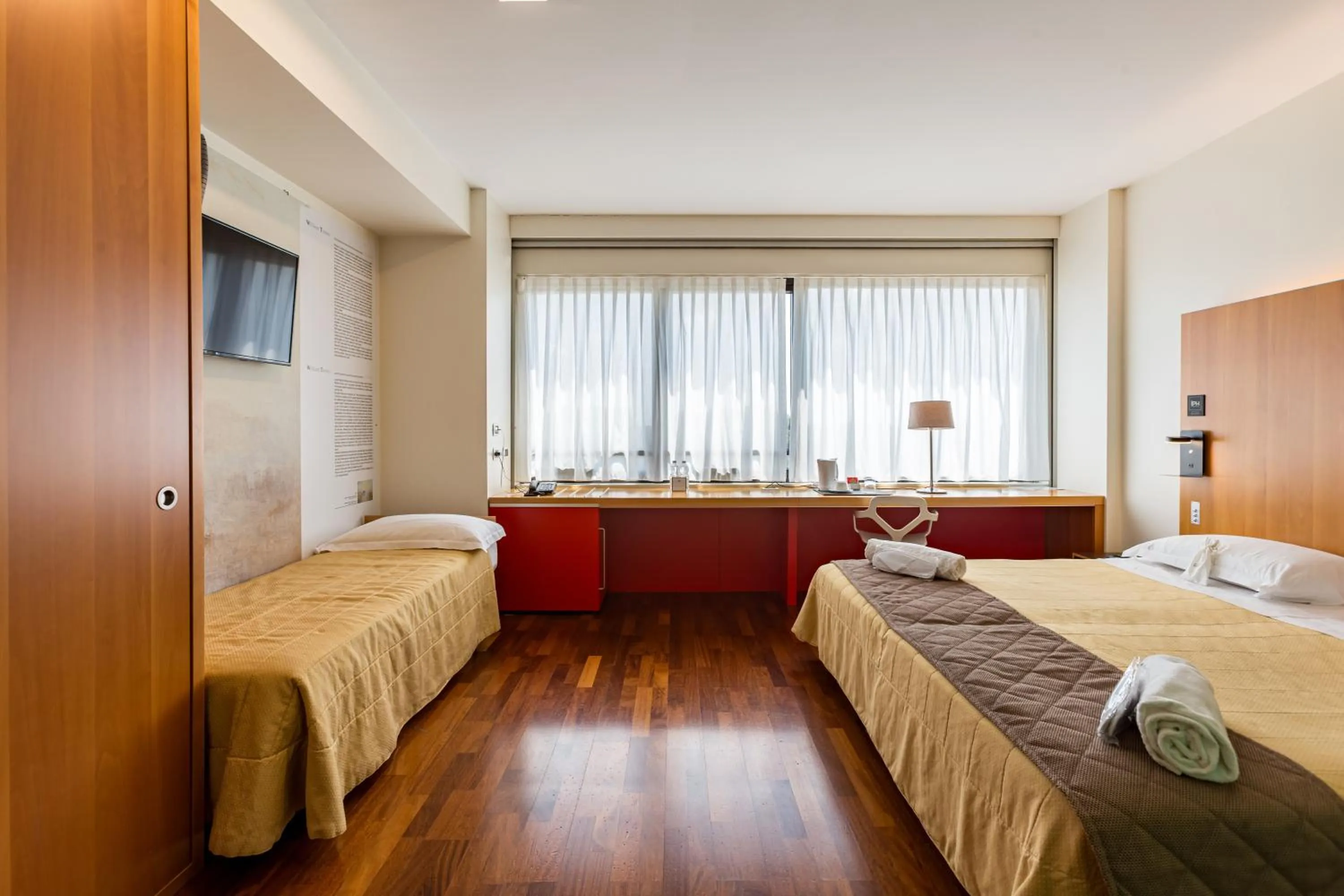 Bed in NEW IPOINT HOTEL