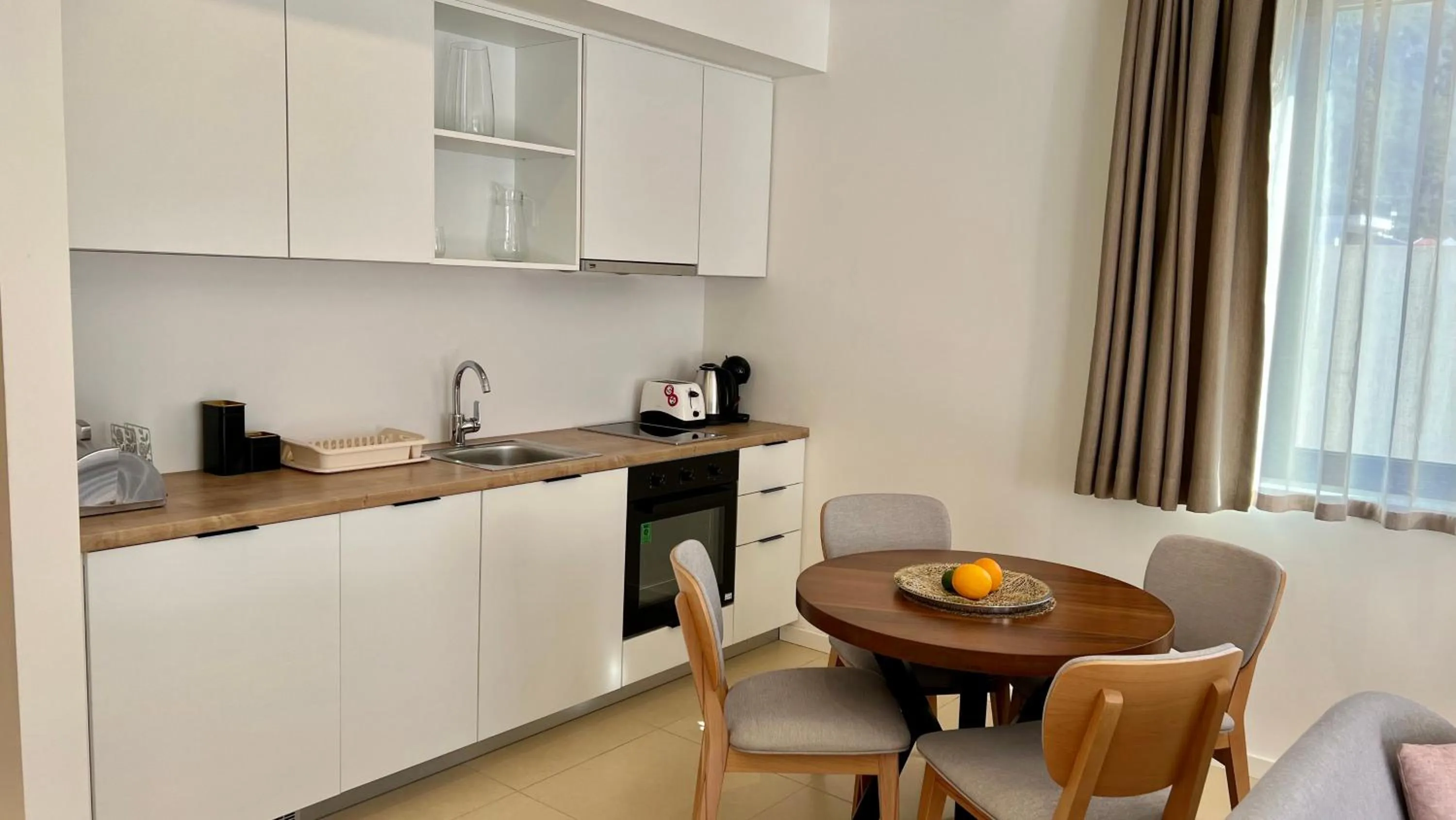 Dining area in Sunraf Luxe Apartments