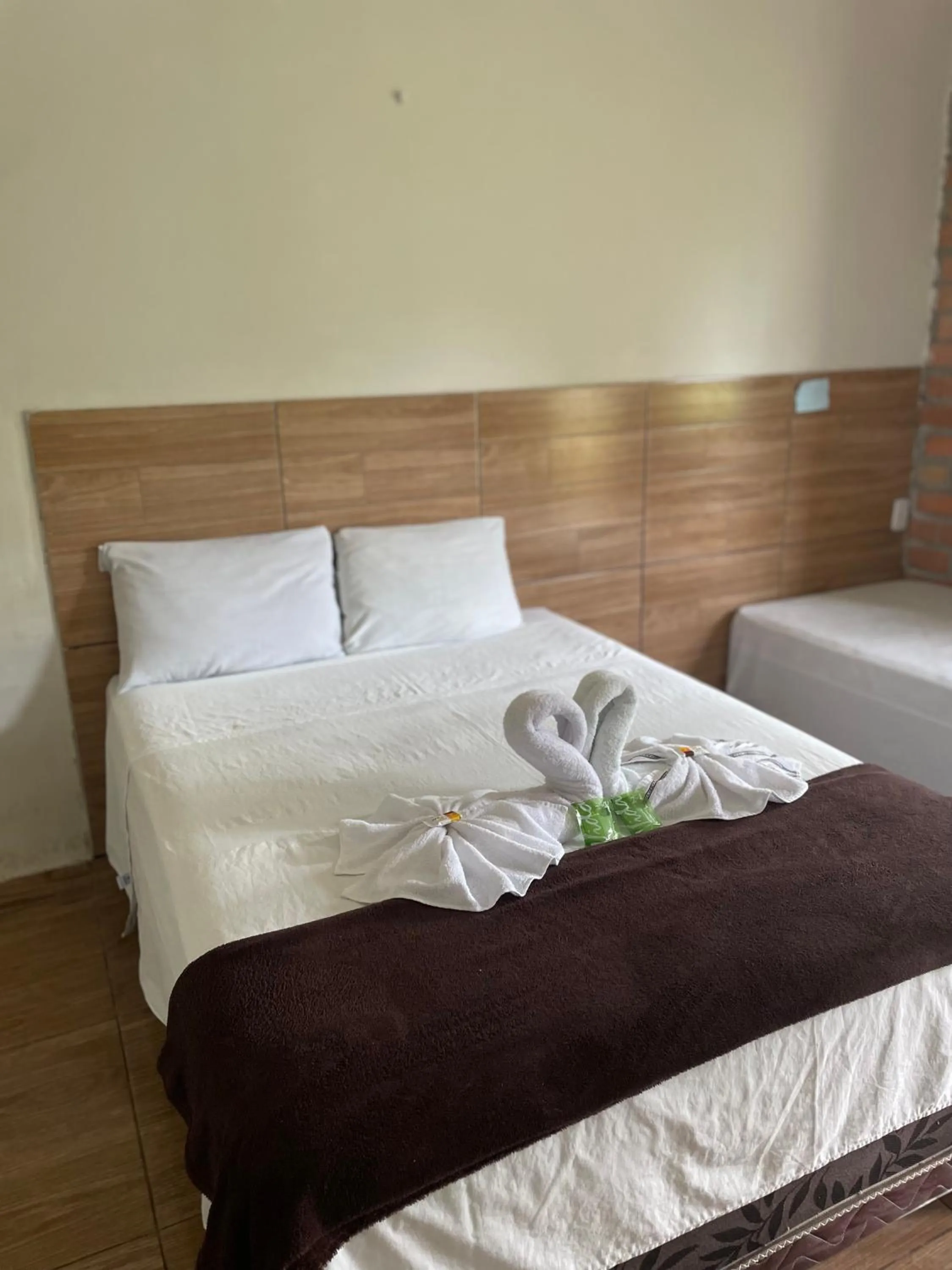 Bed in Pousada RIOSTOUR