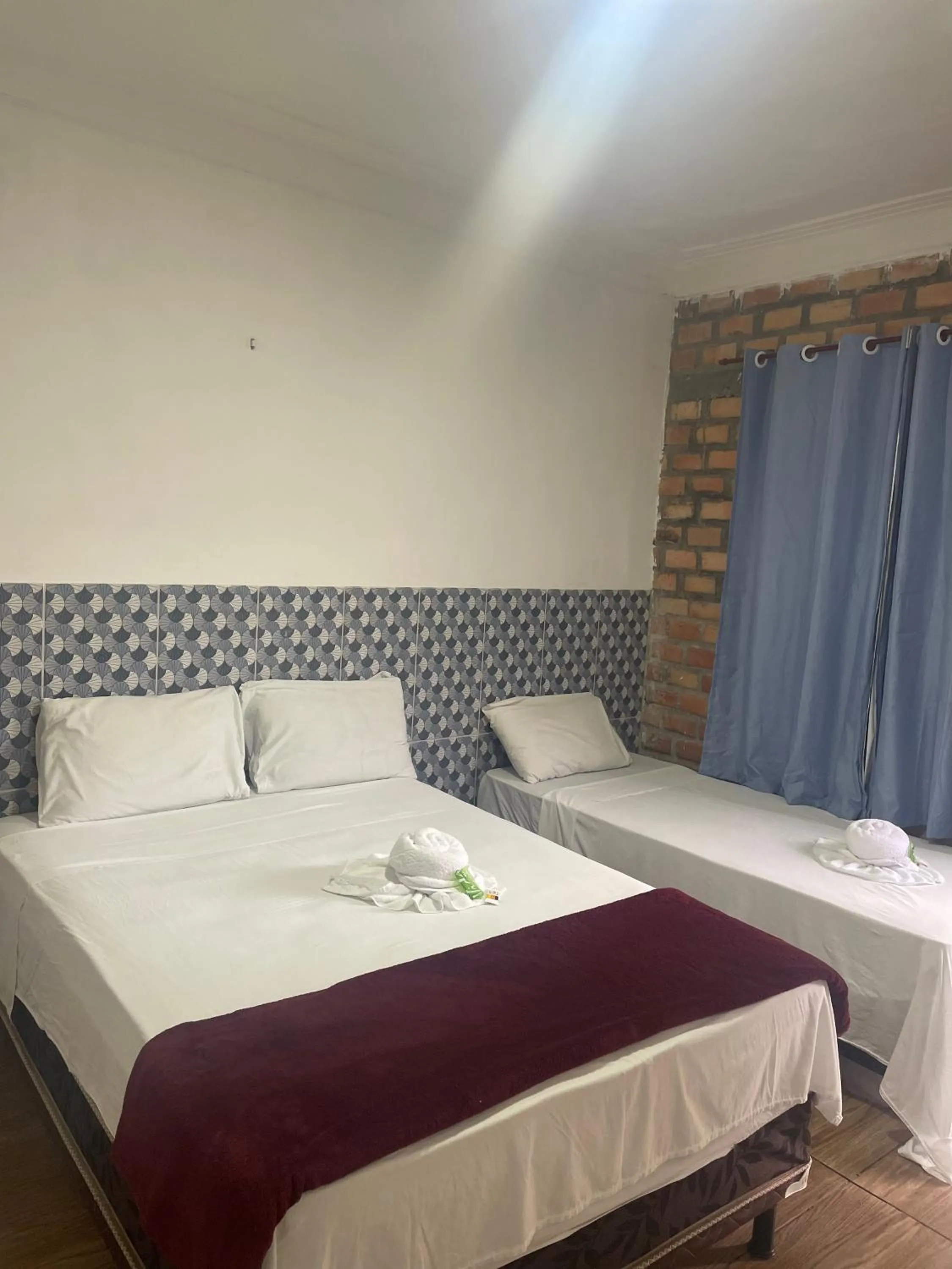 Bed in Pousada RIOSTOUR