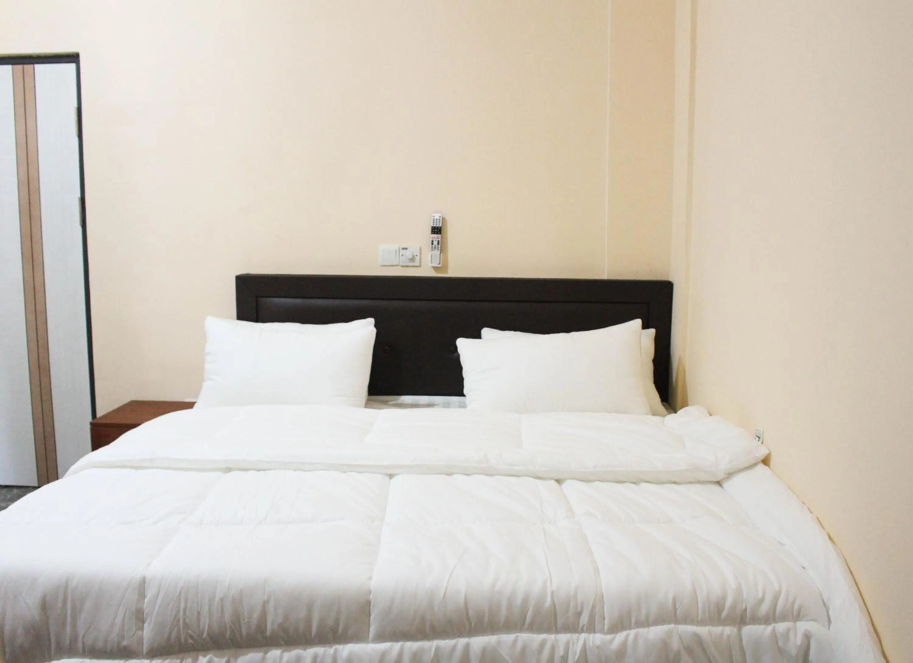 Bed in High Level Apartment