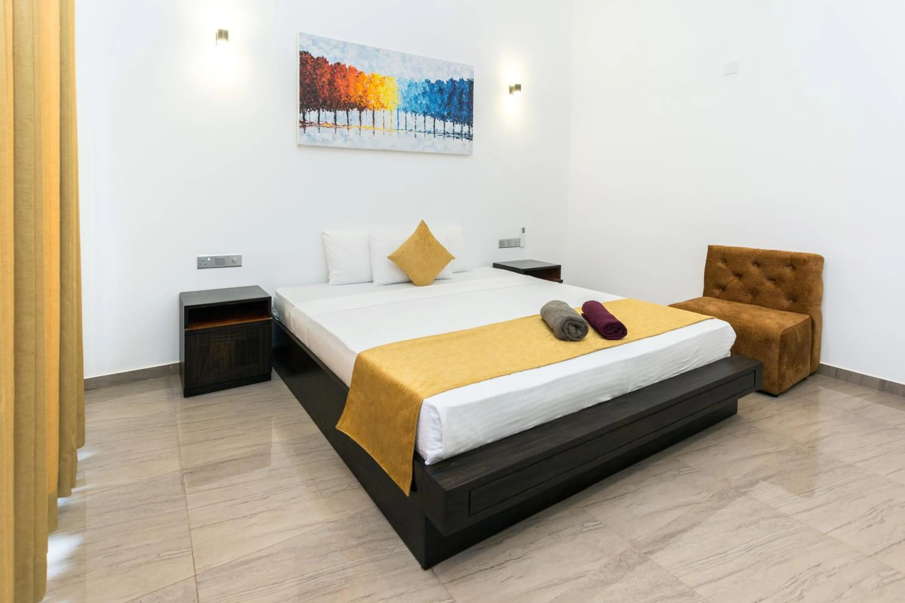 Bed in Polhena Grand Resort & Banquet